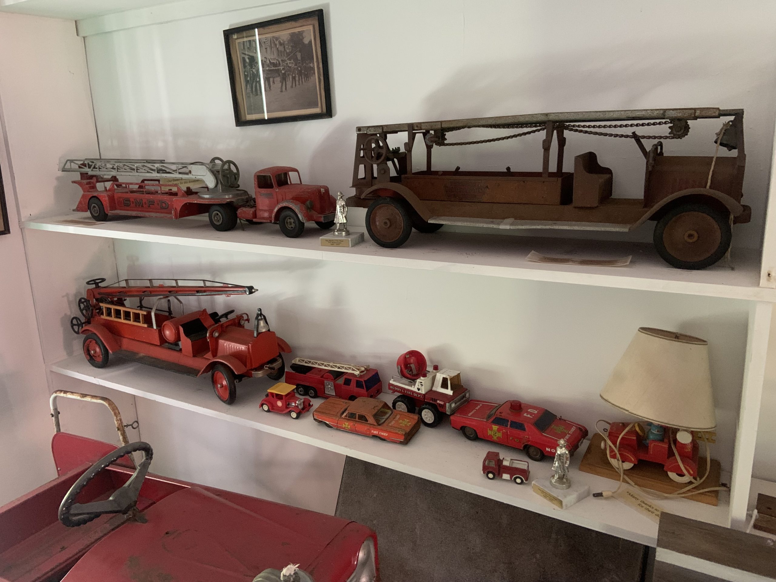 Antique fire truck toys occupy a corner of the Sag Harbor Fire Department Museum. STEPHEN J. KOTZ