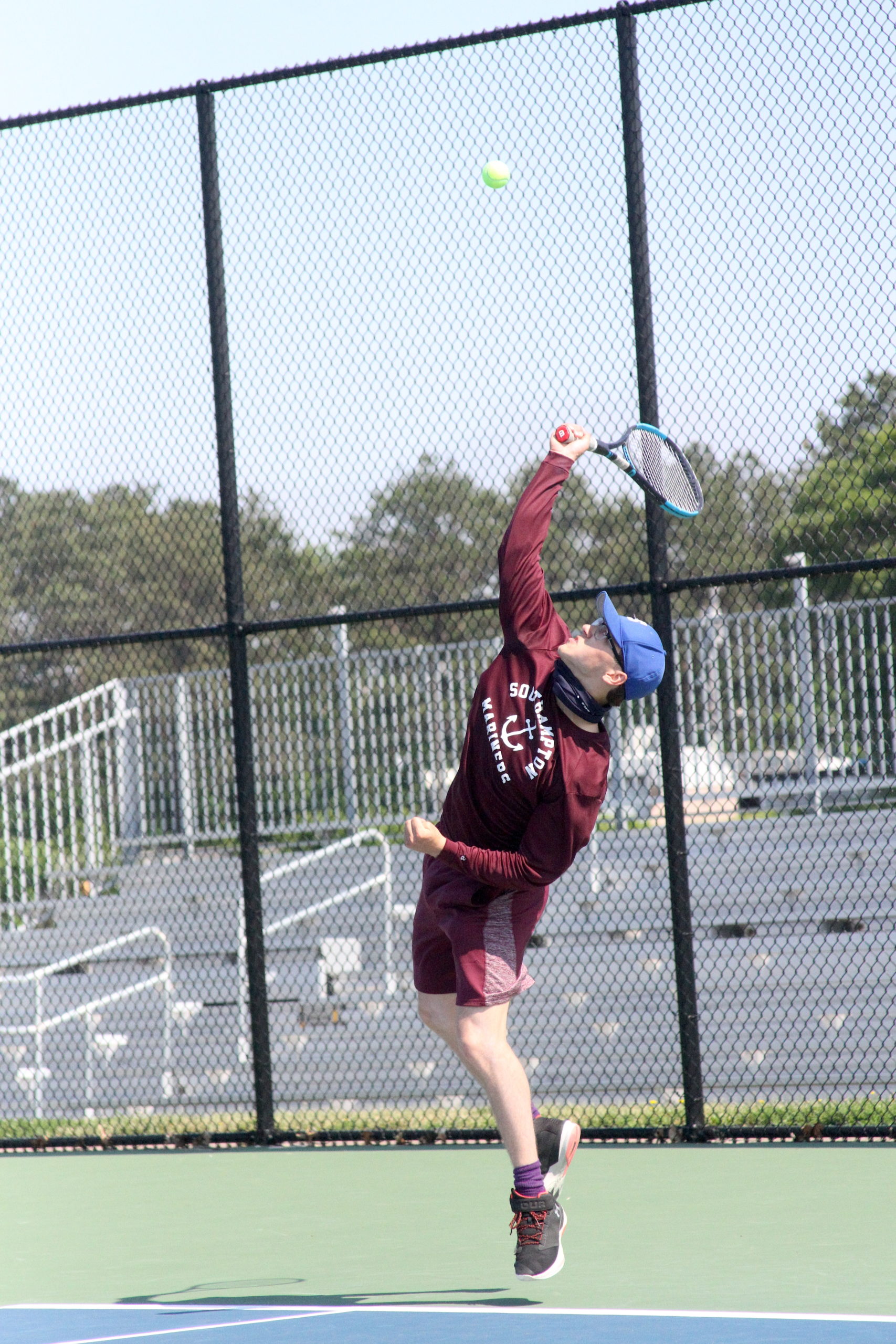 Southampton senior Tyler Moore serves the ball during his doubles team's Division IV semifinal match. DESIRÉE KEEGAN