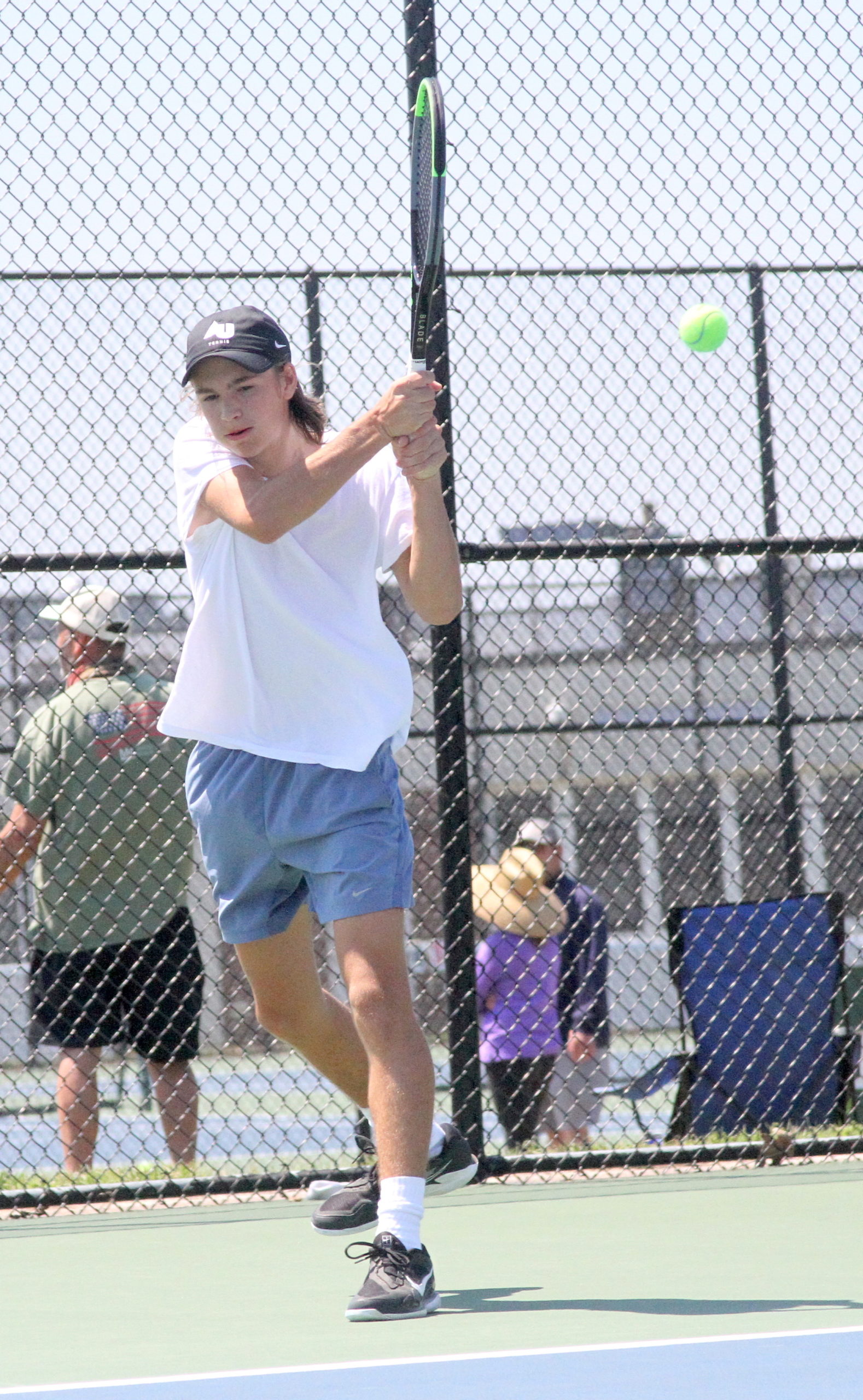 East Hampton sophomore Max Astilean sends the ball back over the net in his Division IV quarterfinals match. DESIRÉE KEEGAN