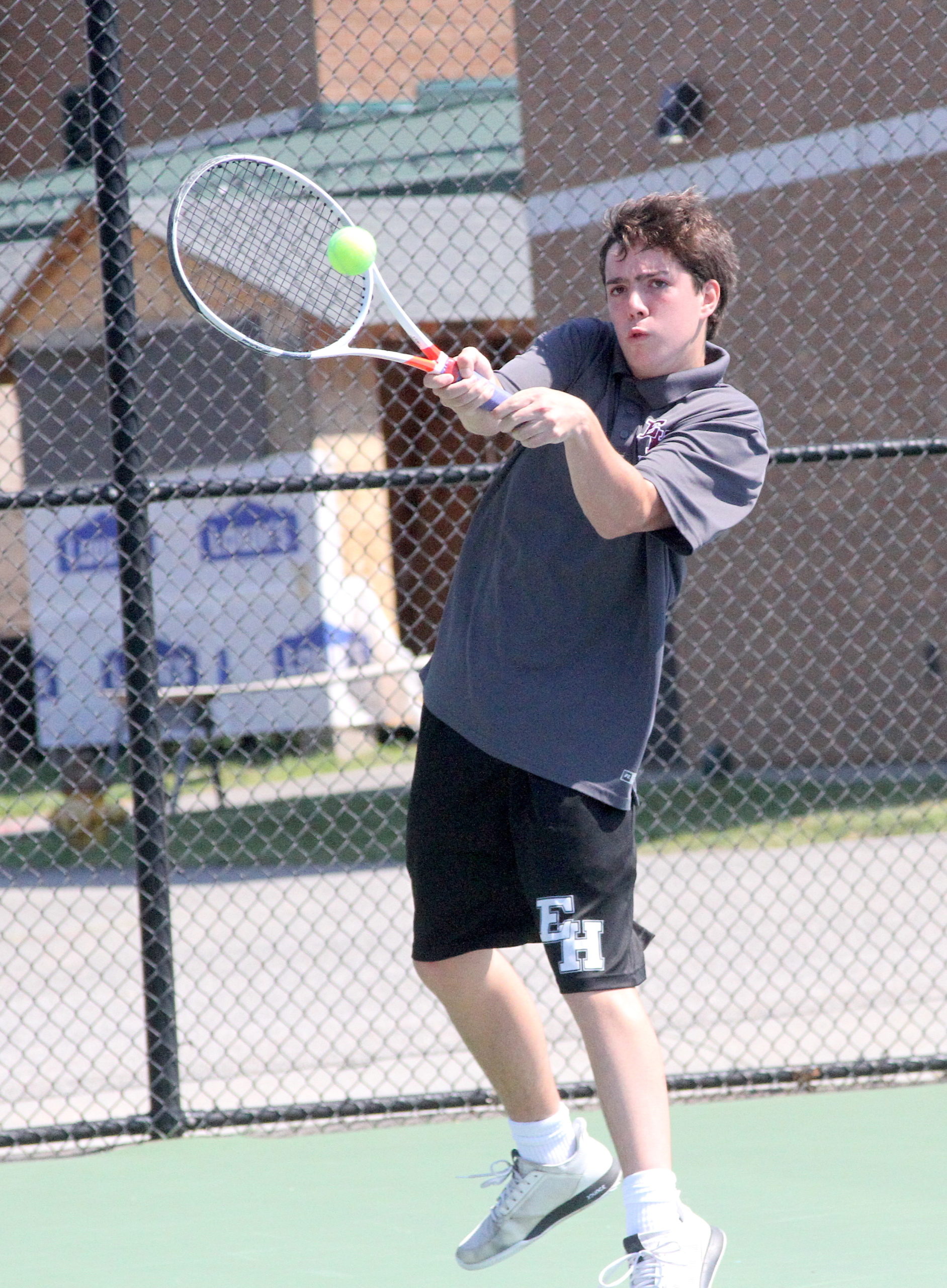East Hampton freshman Nick Cooper connects with the ball during his Division IV quarterfinals match. DESIRÉE KEEGAN