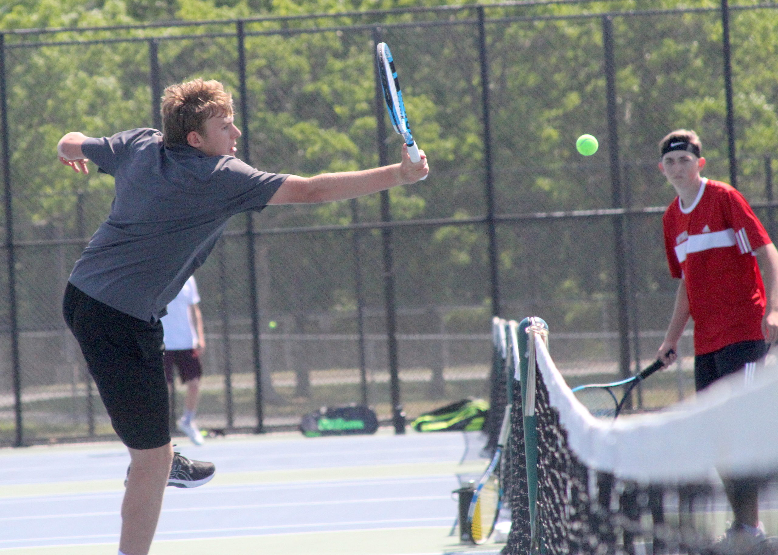 East Hampton senior RJ Jones volleys at the net for the Bonackers in the quarterfinals of the Division IV doubles tournament. DESIRÉE KEEGAN