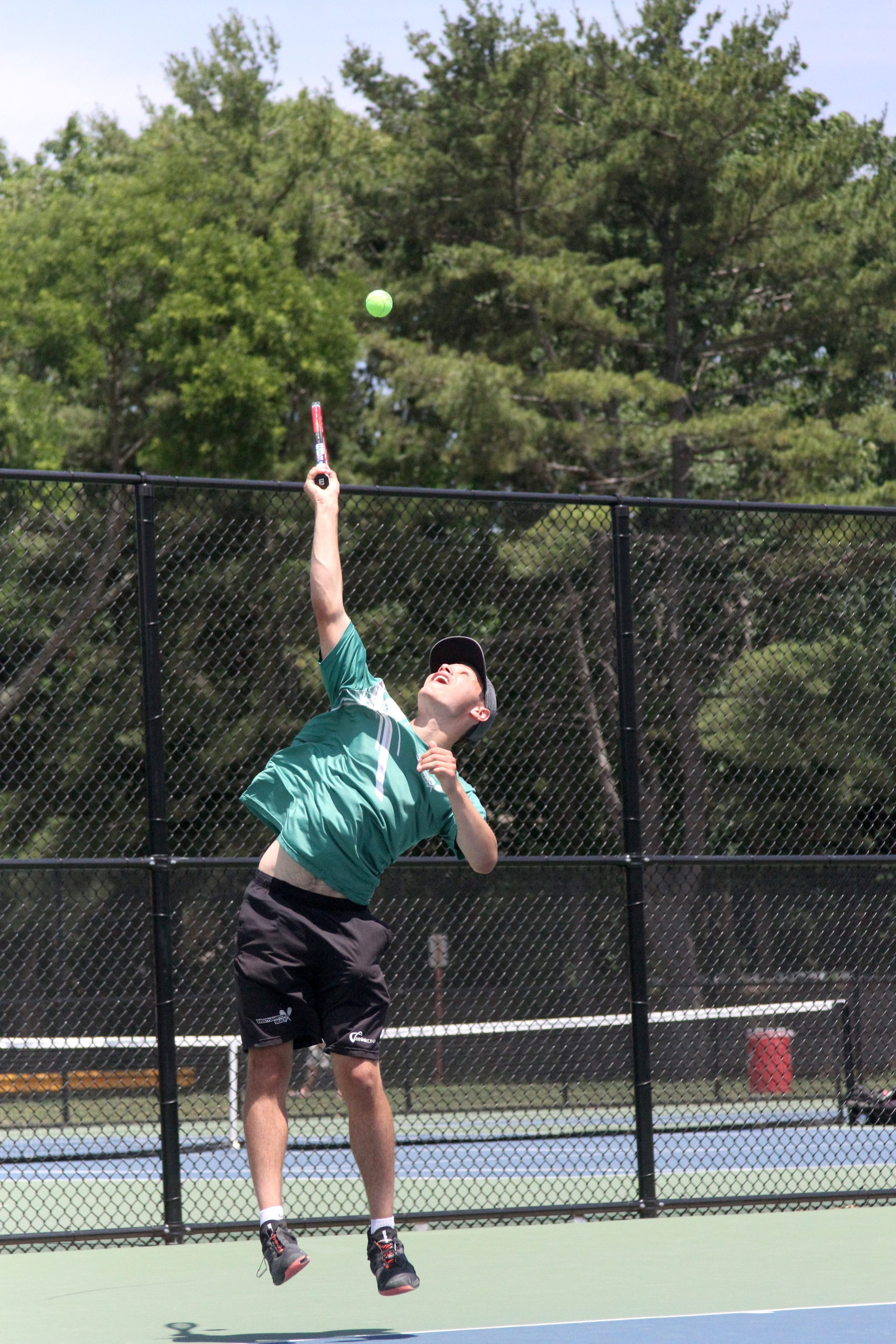 Westhampton Beach senior Josh Kaplan serves up a winner. DESIRÉE KEEGAN