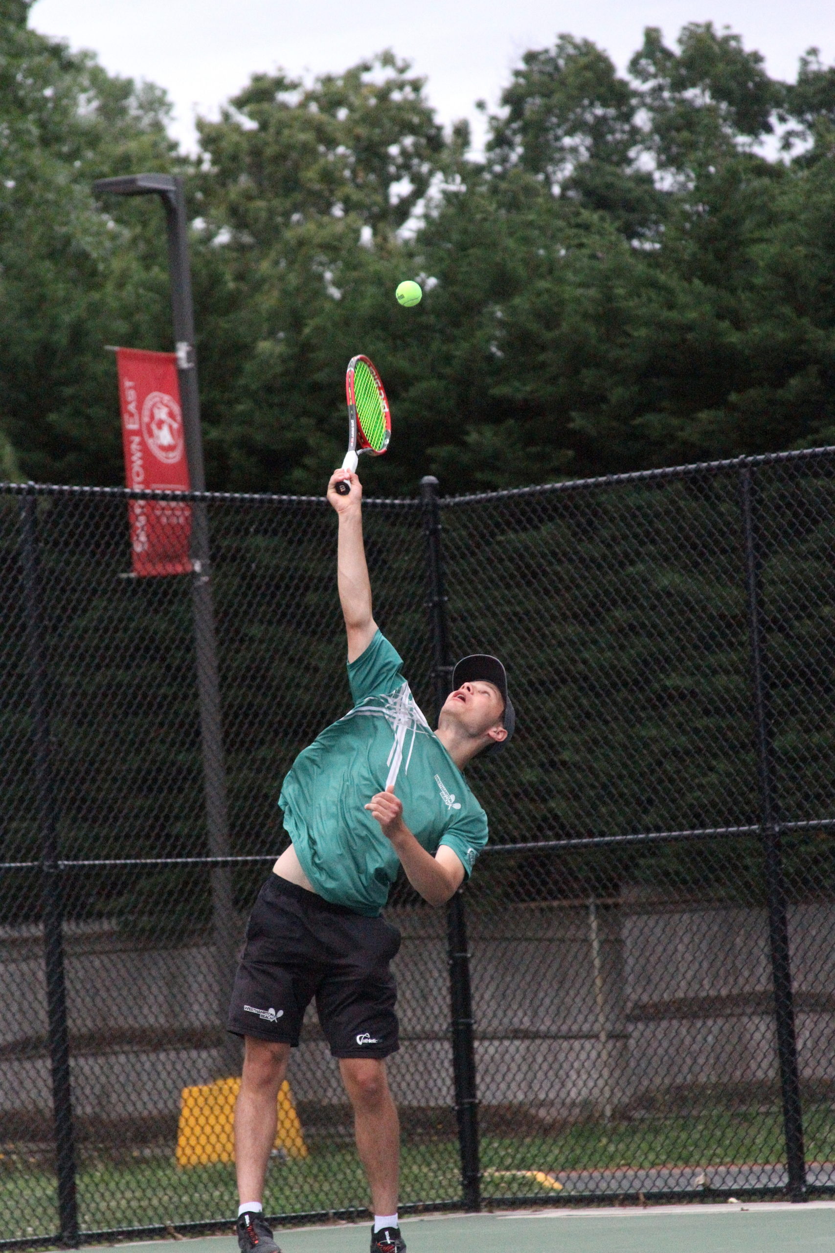 Westhampton Beach senior Josh Kaplan serves the ball. DESIRÉE KEEGAN