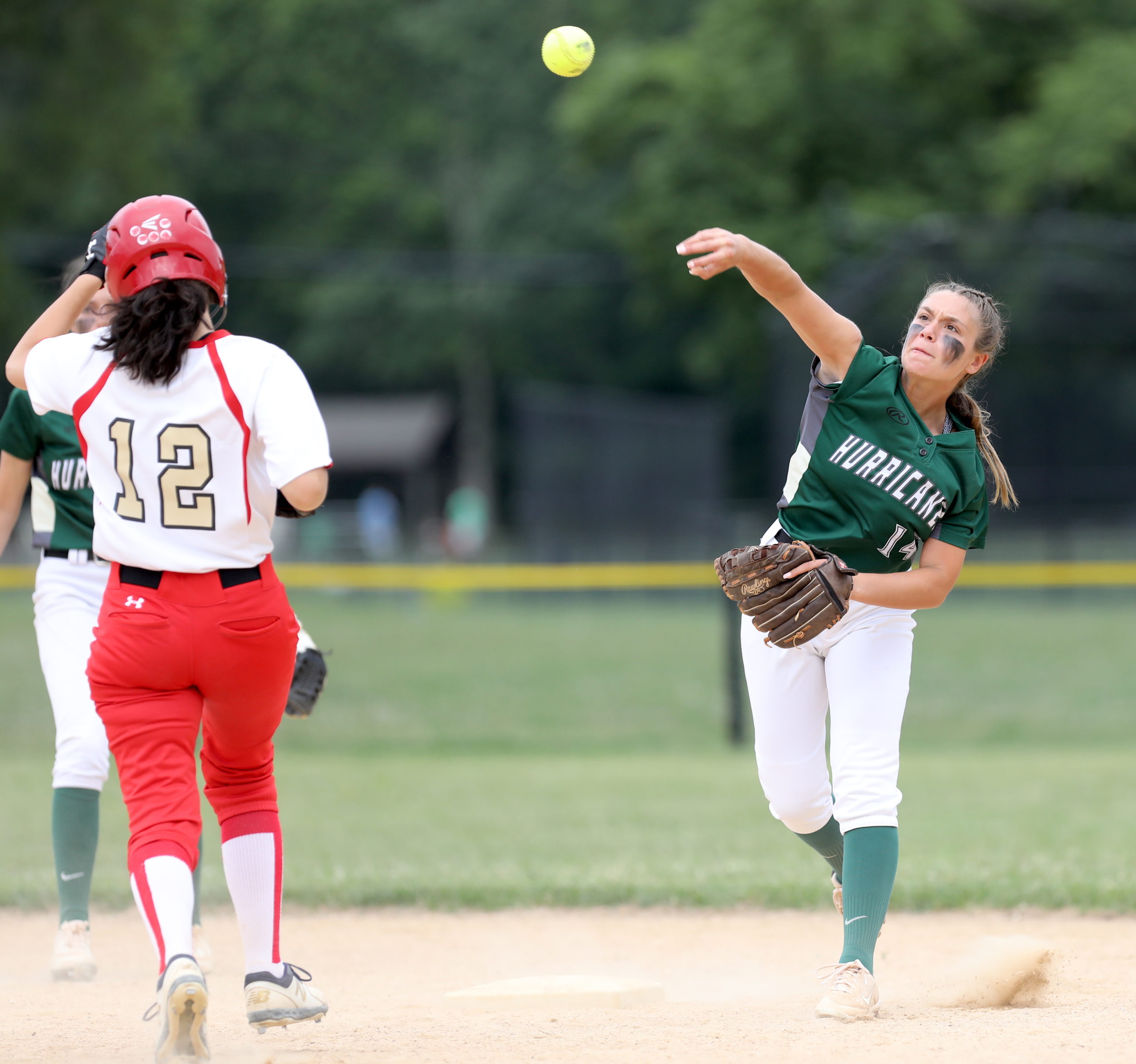 Westhampton Beach senior Elana Seltzer throws the ball home from second base after a forced out. CHRISTINE HEEREN