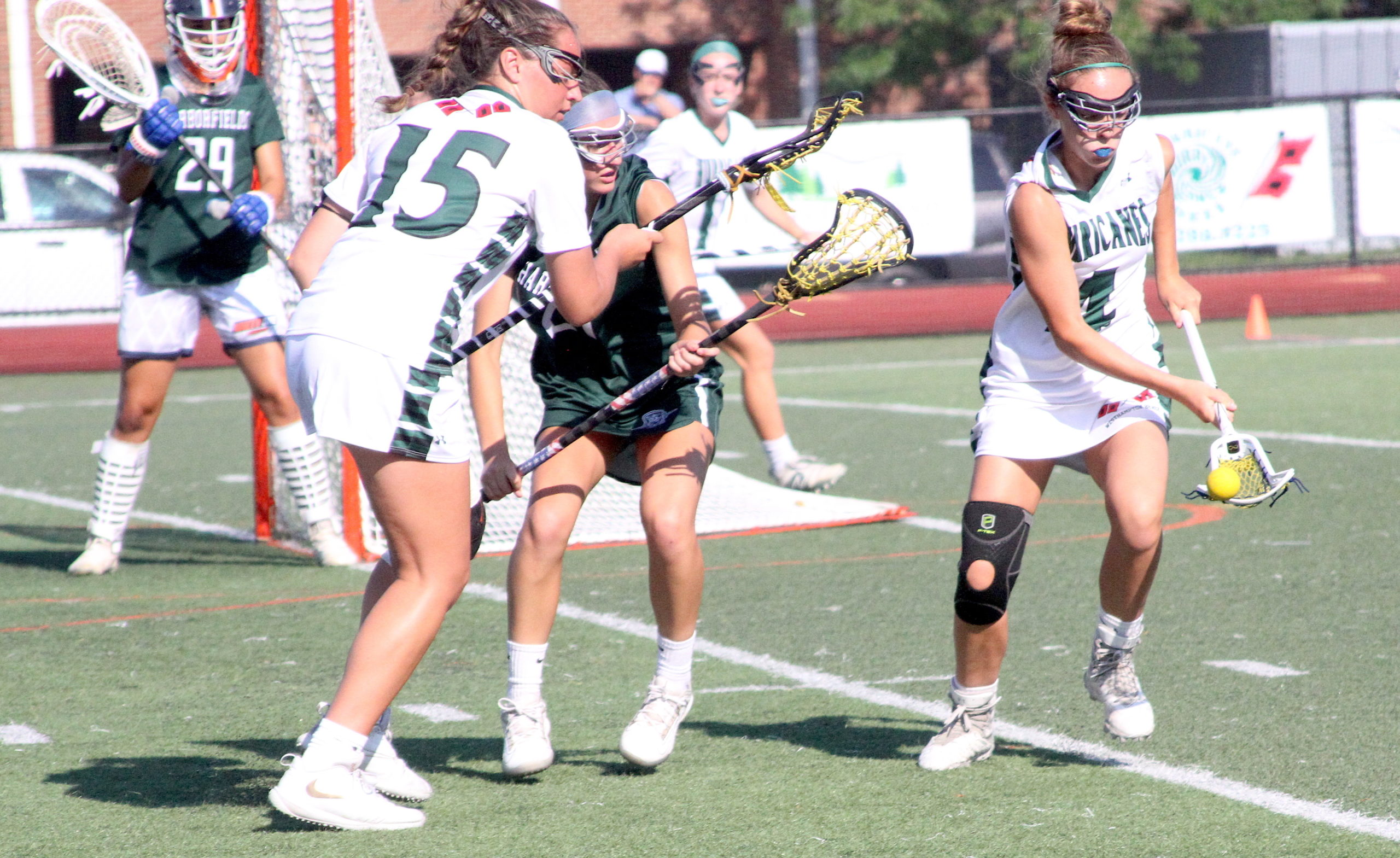 Westhampton Beach seventh-grader Ava Derby scoops up a ground ball to regain possession for the Hurricanes. DESIRÉE KEEGAN