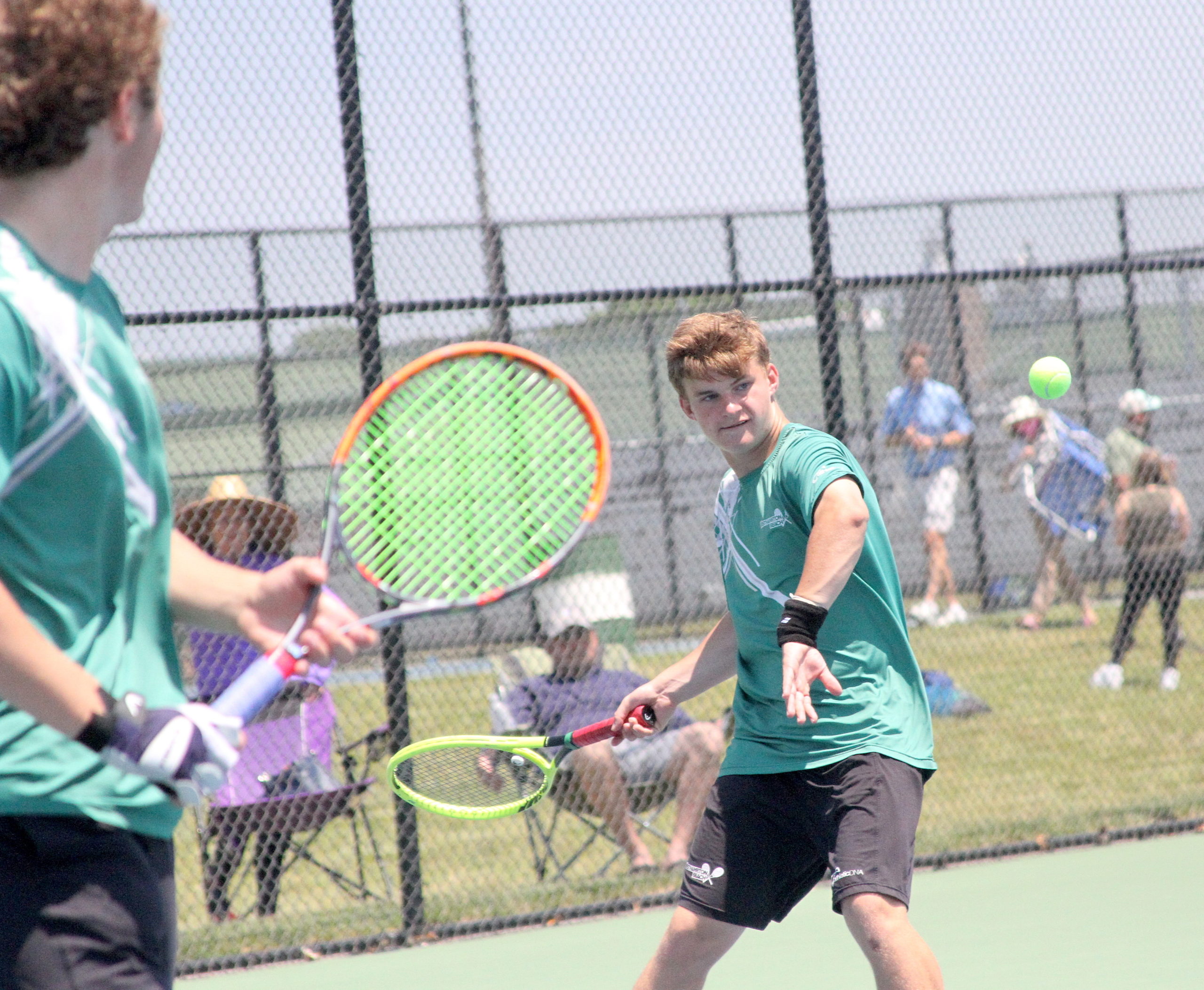 Westhampton Beach sophomore Bobby Stabile returns a serve during his doubles team's Division IV finals match. DESIRÉE KEEGAN