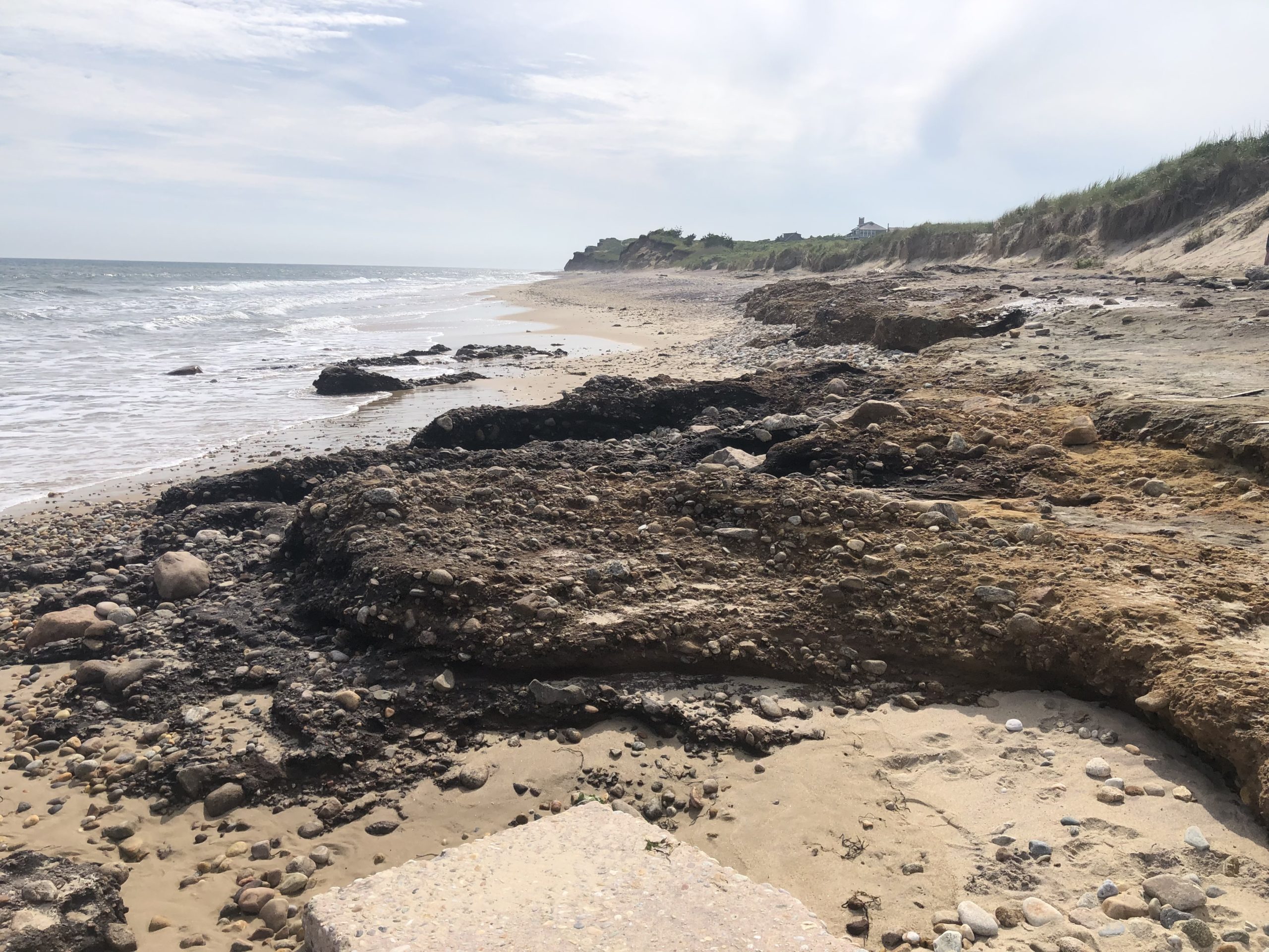 Ditch Plains beach in Montauk was scoured of nearly all of its sand by the Memorial Day weekend storm, leaving town officials to consider trucking in tons of sand to try and restore at least some of the bathing beach before the height of the summer season.