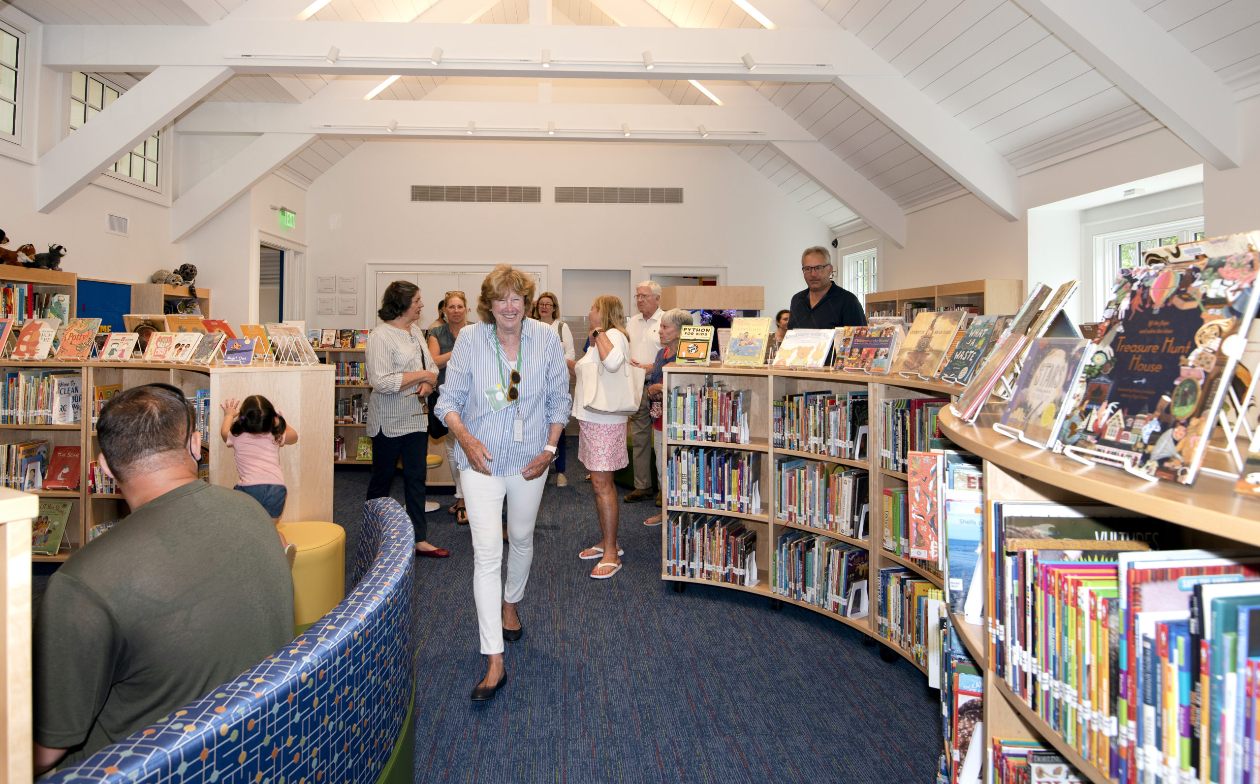 Visitors take a tour of the children's room at the Quogue Library.      VERONIQUE LOUIS