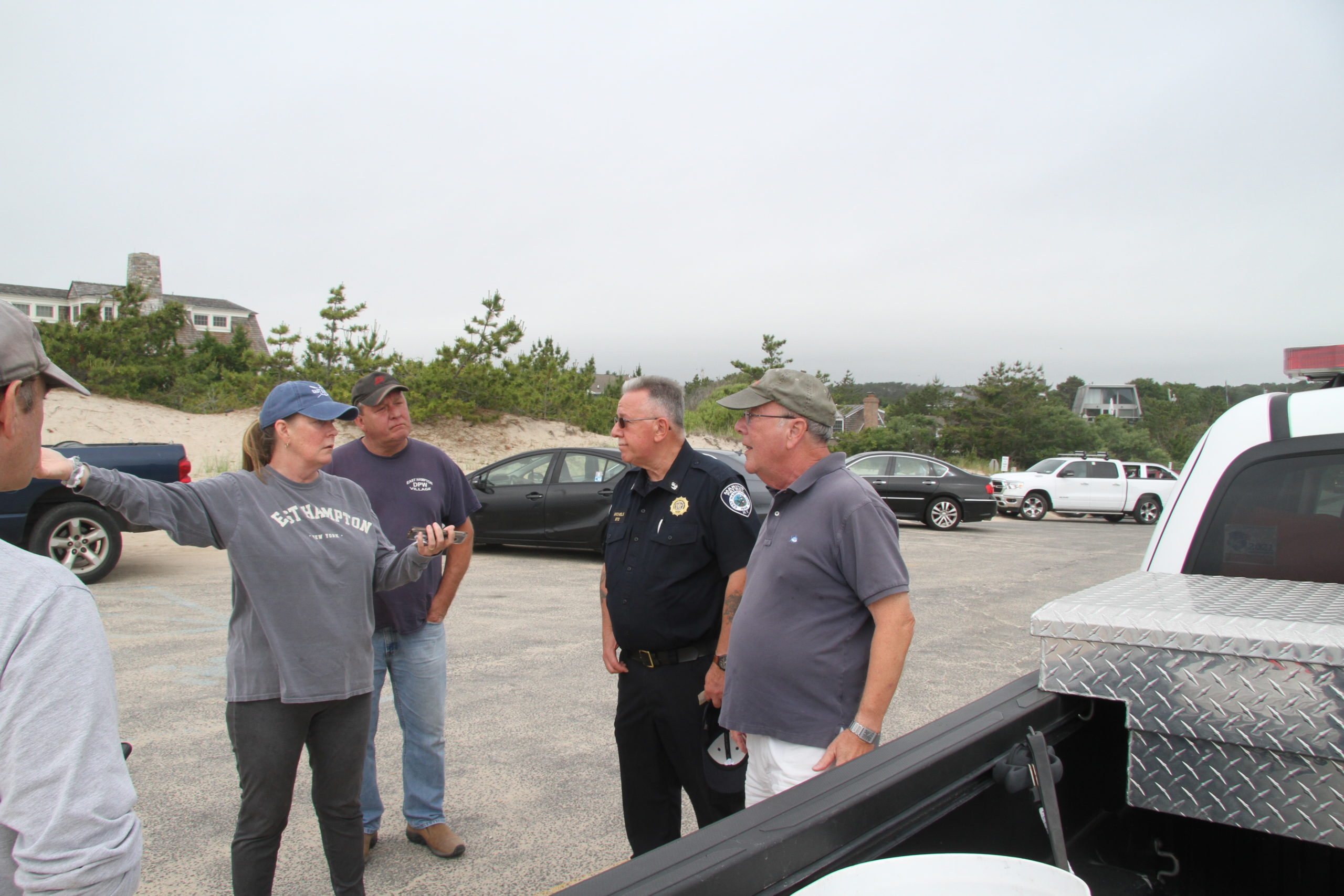 Springs resident Denise Forde, left, asked homeowner Ken Silverman why homeowners expect police to guard the beach from potential trespassers.