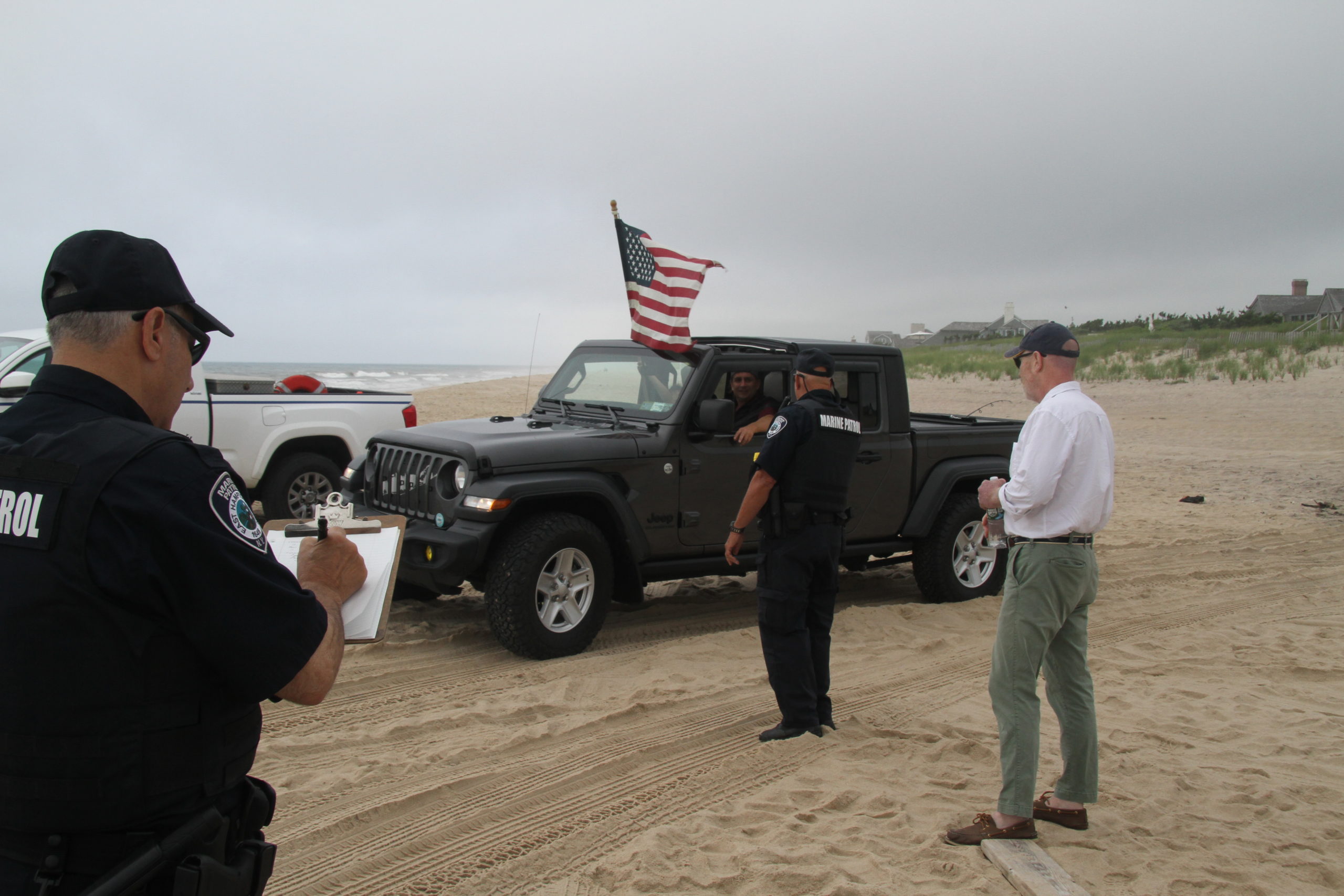 Marine Patrol officers took down license plates but said trespassing summonses would not be issued unless a complaint was made by homeowners.