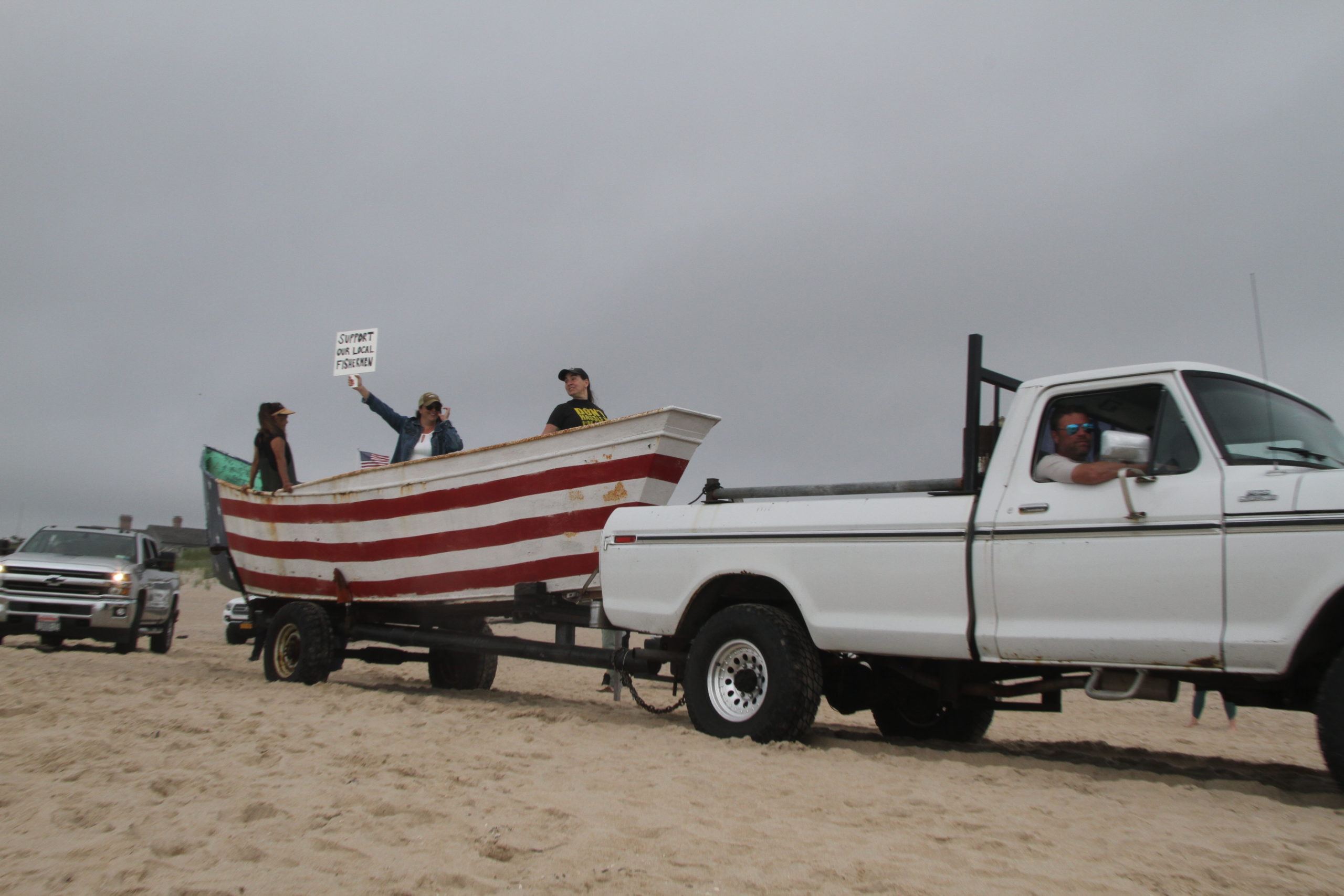 Commercial fishermen led the parade because the court has ruled that the beach may still be used for fishing and fishing related purposes, though whether vehicles must be considered a critical component to that has yet to be hashed out in court.