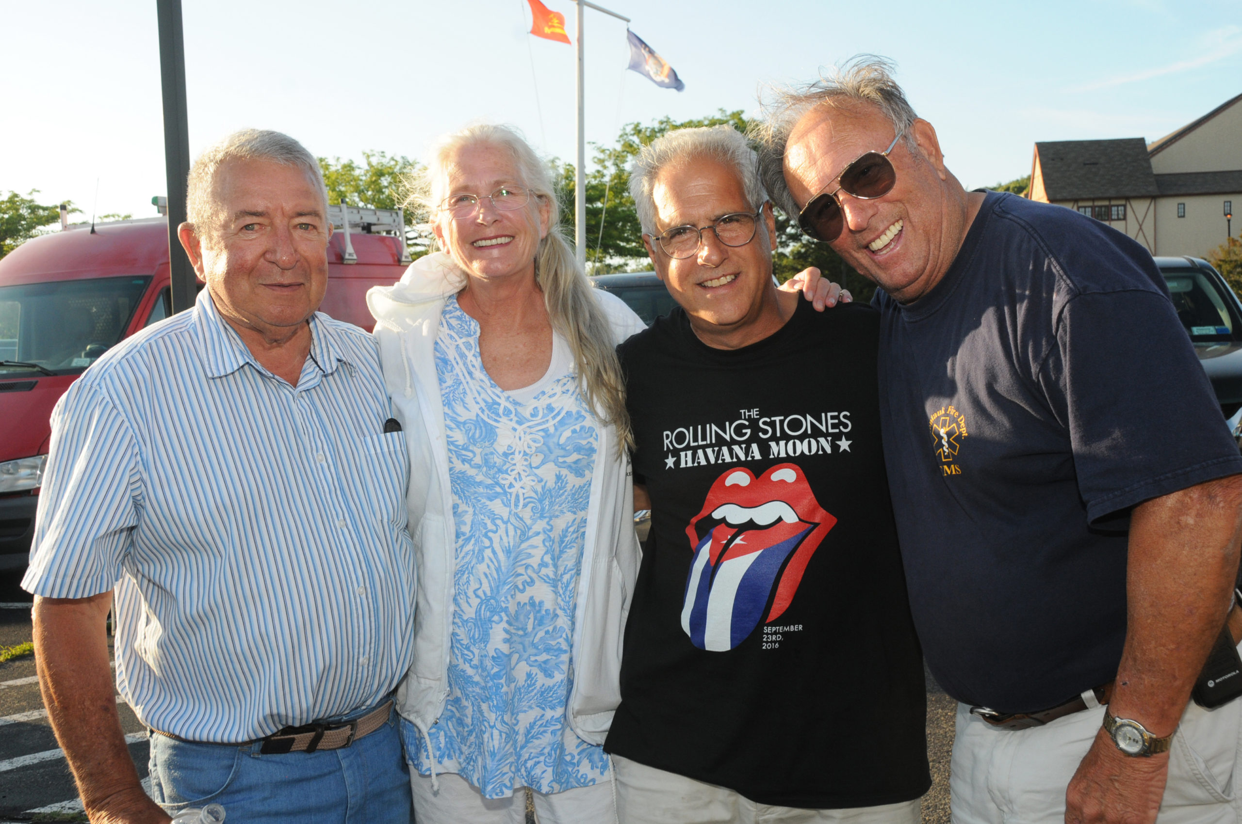 Charles Morici, Lisa and Tom Grenci, Jr, and Charlie Grimes at the  Montauk Fire Department held its Annual Barbecue on June 28. Members and their Families enjoyed classic picnic food, including burgers, corn on the cob, hot dogs and Dreesen's famous doughnuts. Montauk's John's Drive-In satisfied everyone's sweet tooth with a variety of treats from their ice cream truck.   RICHARD LEWIN