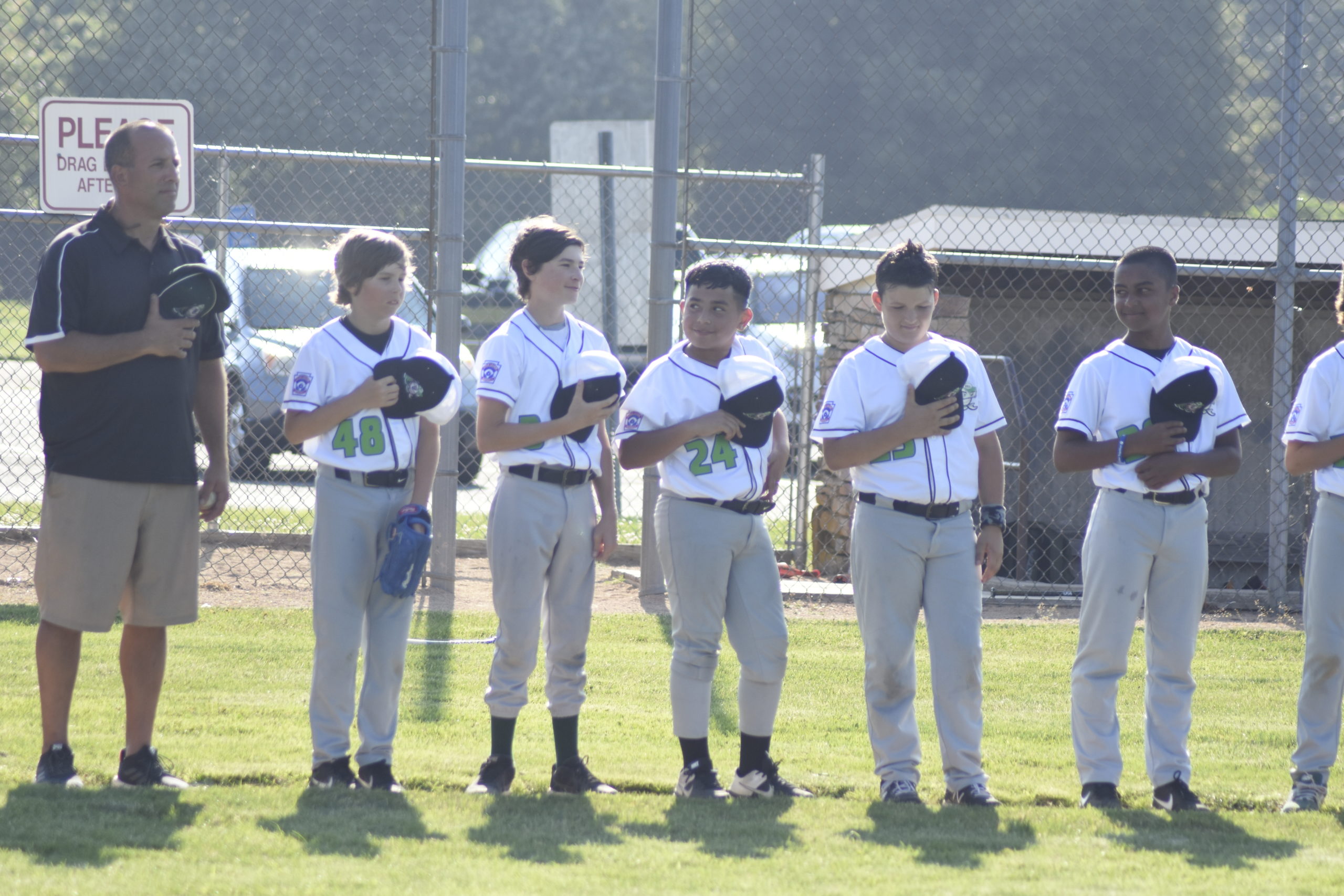East End Little League 12U All-Stars line up on the third base line for the Star-Spangled Banner prior to their game against Southampton on Wednesday, June 30.