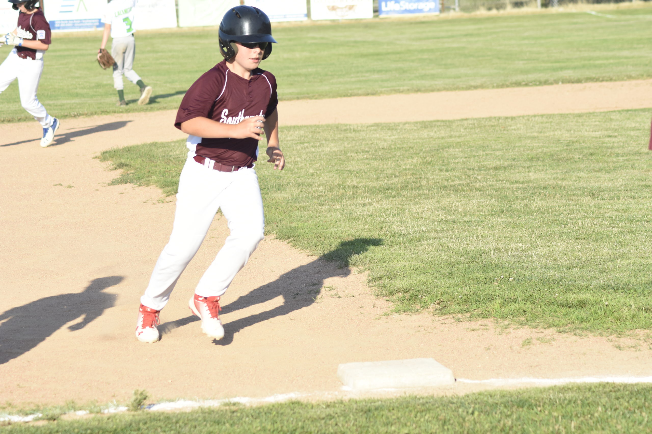 Southampton's Colin Delalio rounds third base and scores.