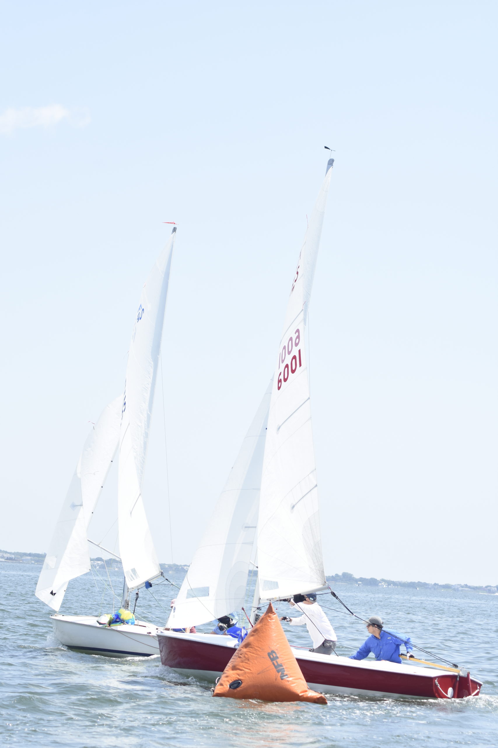 Matt Linehan, Bob Linehan and Ted McCormick, and Tim Feil and John Greiner (6001) make their way around the first marker.