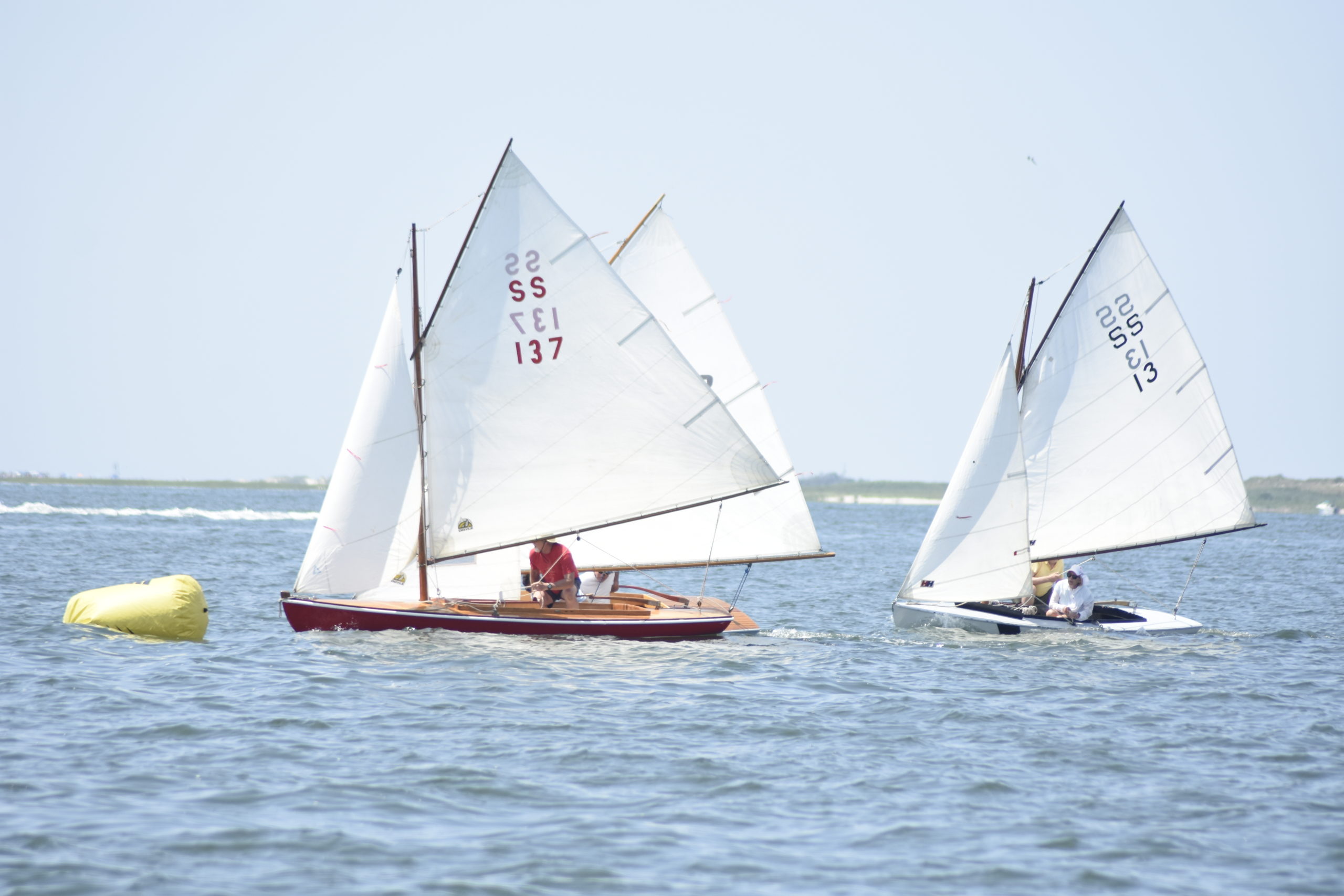 A handful of SS boats reach the first marker of Saturday's first race of the day.