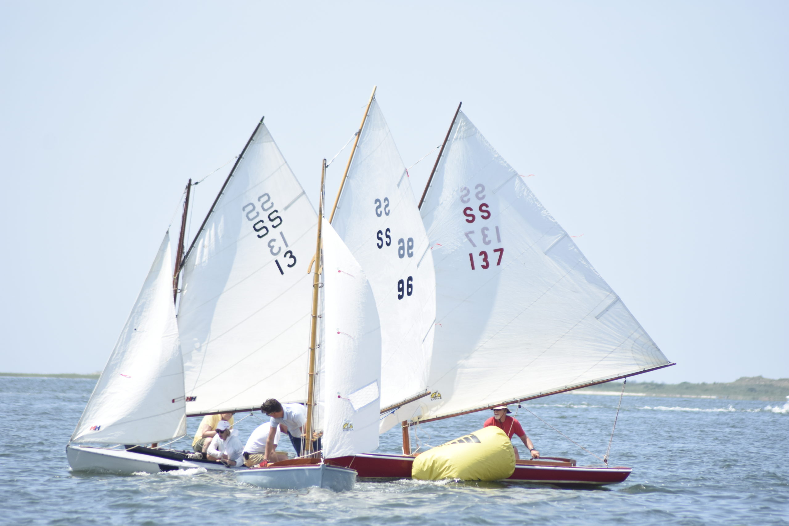 A handful of SS boats reach the first marker of Saturday's first race of the day.