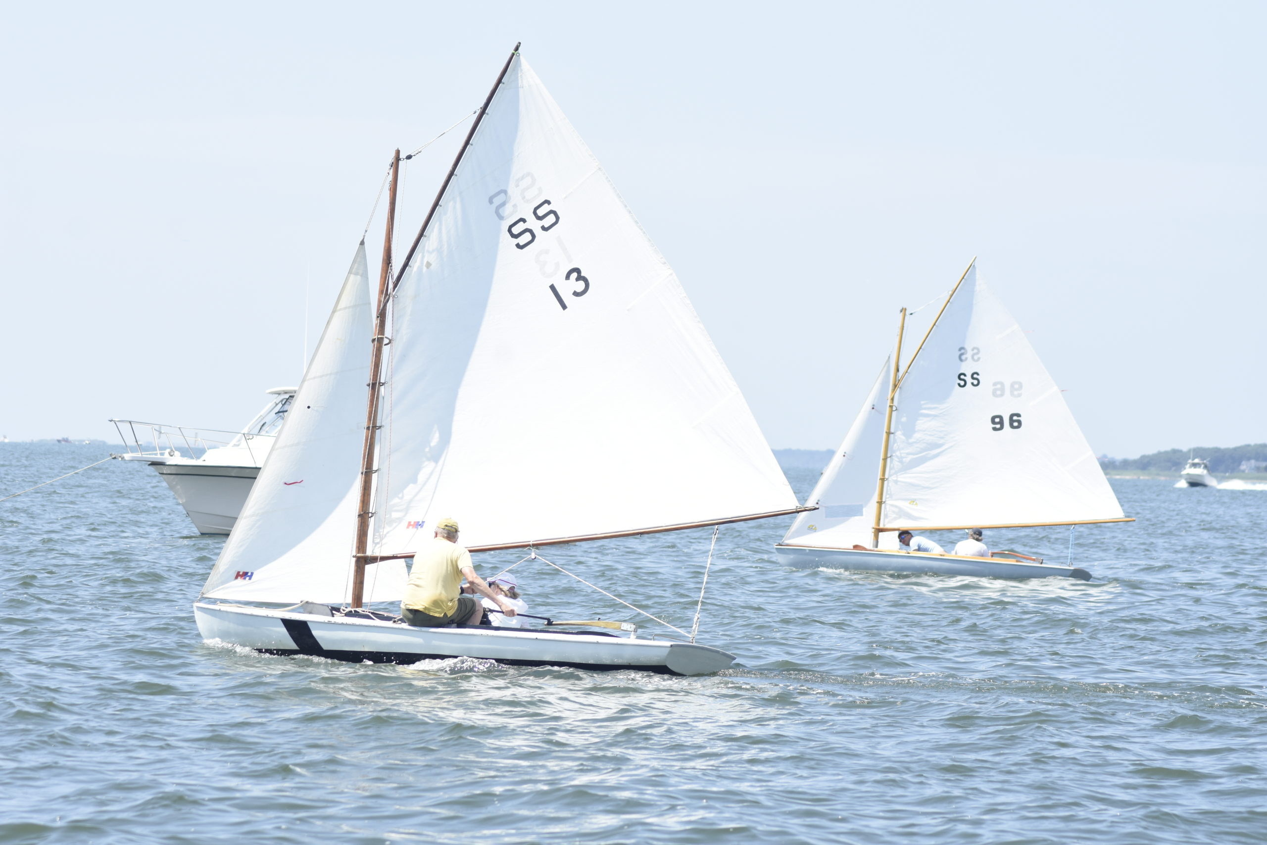 Denise Dalmasse and Deb Dalmasse (13) overtake Abby Connett and Ian Connett for second place of the first SS race on Saturday.