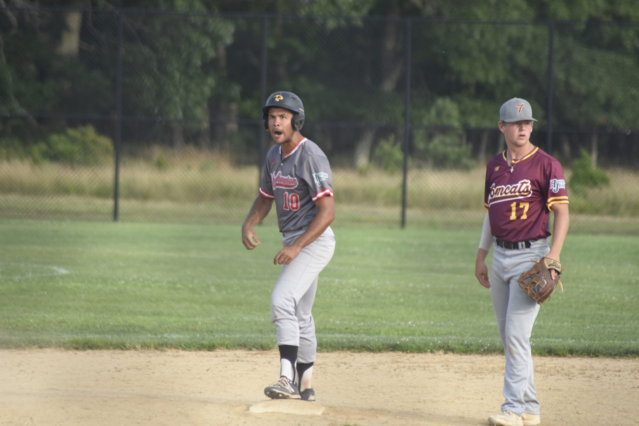 Tim Feliz (Adelphi) is pumped up after stealing second base late in the game.