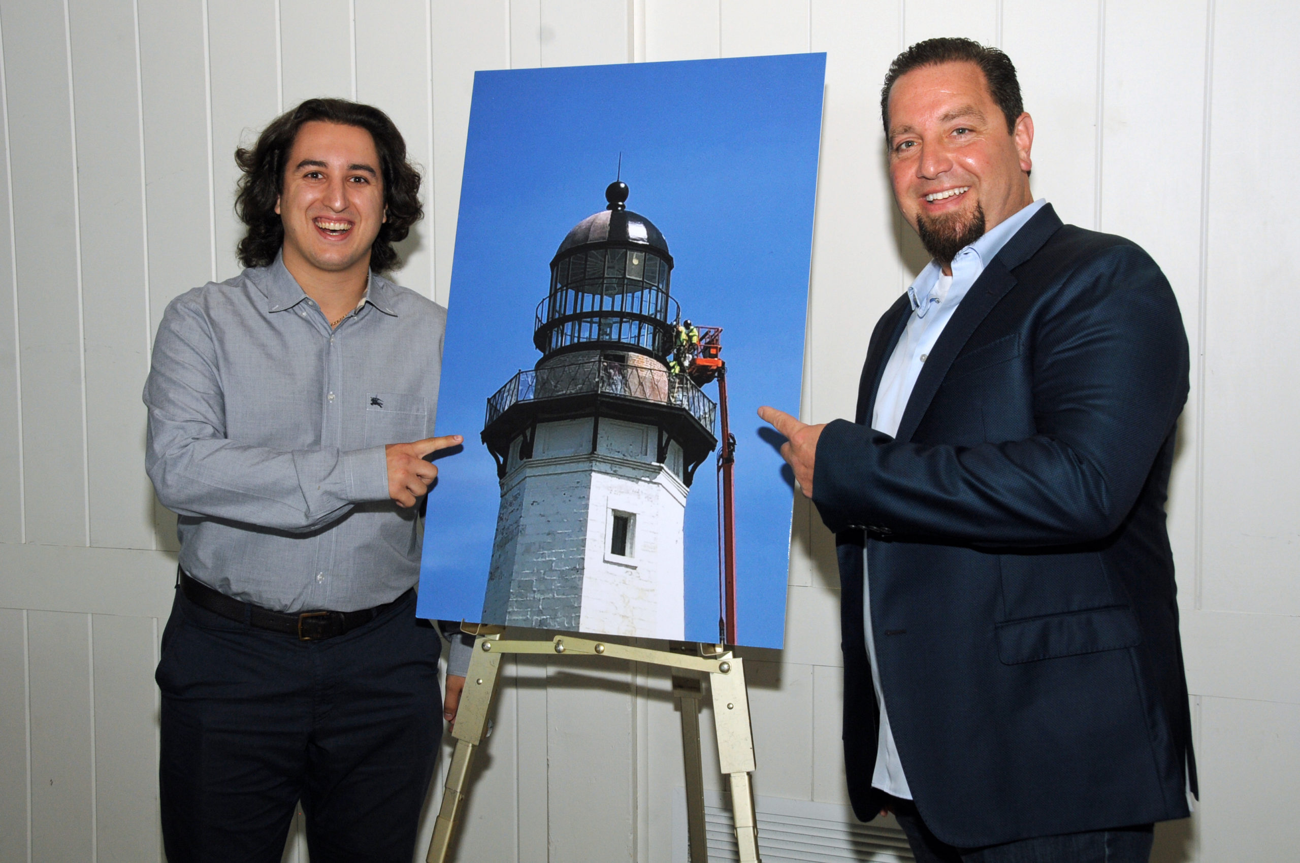 Vincent Amoroso, Jr. and Vincent Amoroso, father and son from Installation Specialties Group the company that is working on the lighthouse restoration at the Montauk Historical Society's cocktail party on July 14 to launch a public capital campaign for the Montauk Point Lighthouse restoration.  Work on restoring the tower began in 2019, and is scheduled to be completed by next year.     RICHARD LEWIN