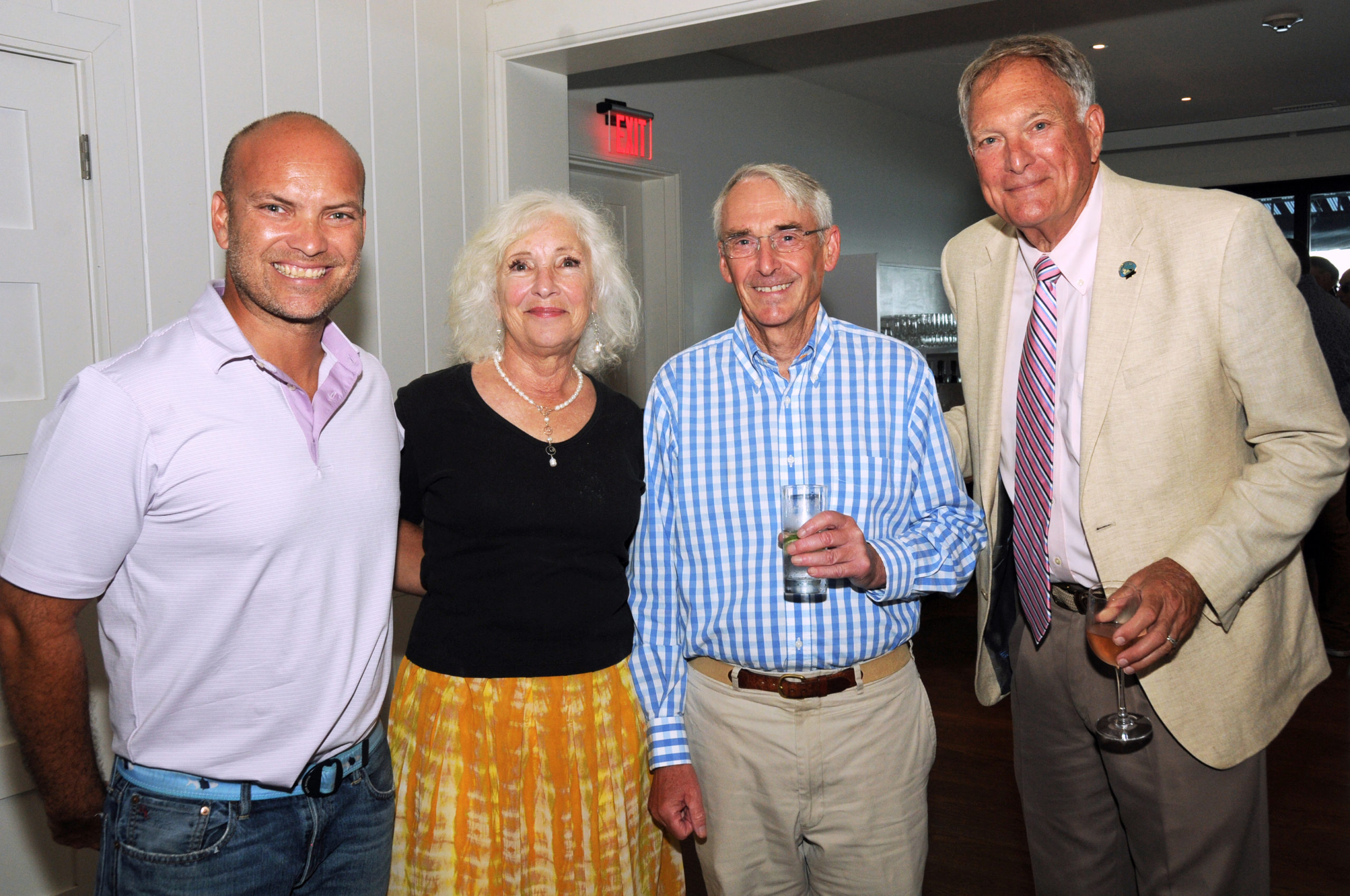 East Hampton Town Councilman David Lys; Executive Director of the Robert David Lion Gardiner Foundation Kathryn Curran; Robert Hefner and Noel Gish at the Montauk Historical Society's cocktail party on July 14 to launch a public capital campaign for the Montauk Point Lighthouse restoration.  Work on restoring the tower began in 2019, and is scheduled to be completed by next year.     RICHARD LEWIN