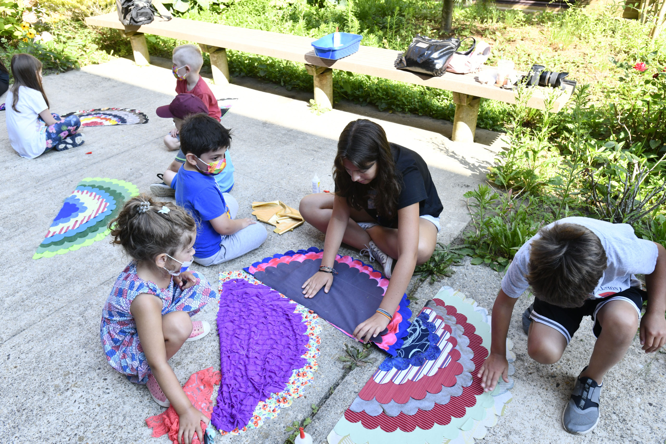 Children work on their wings in the Peace Garden at Southampton high School on Friday morning.  DANA SHAW