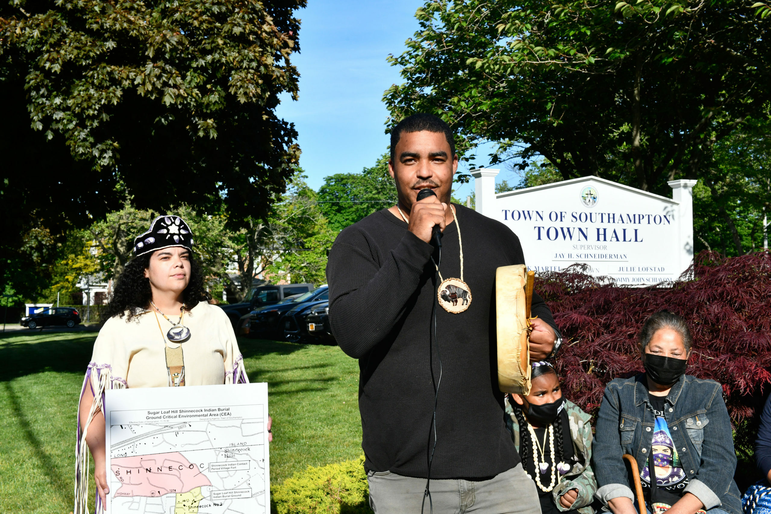 Tela Troge, Shane Week and Rebecca Genia at a rally in front of Southampton Town Hall last year.  DANA SHAW