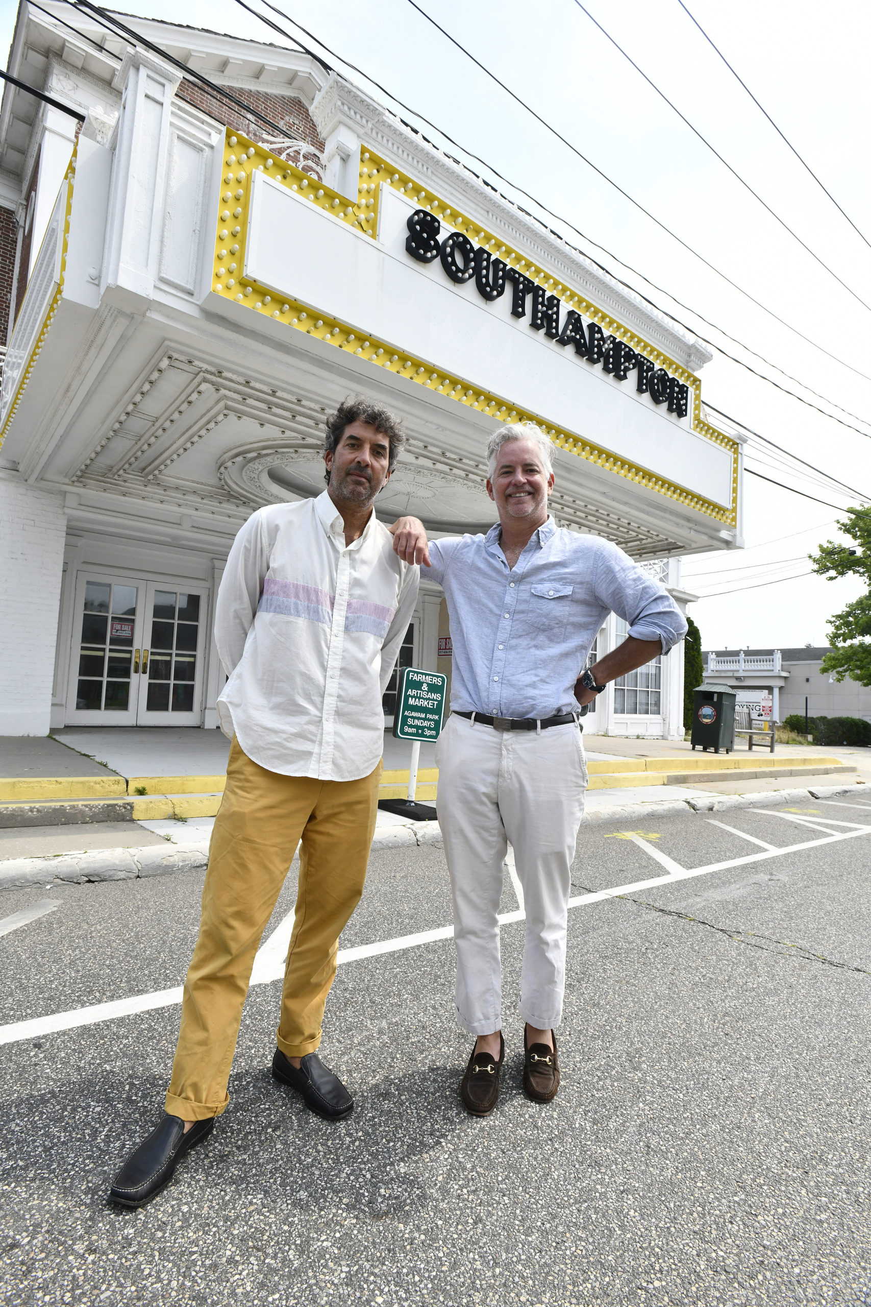 Orson and Ben Cummings in front of the Southampton movie theater on Tuesday afternoon.  DANA SHAW