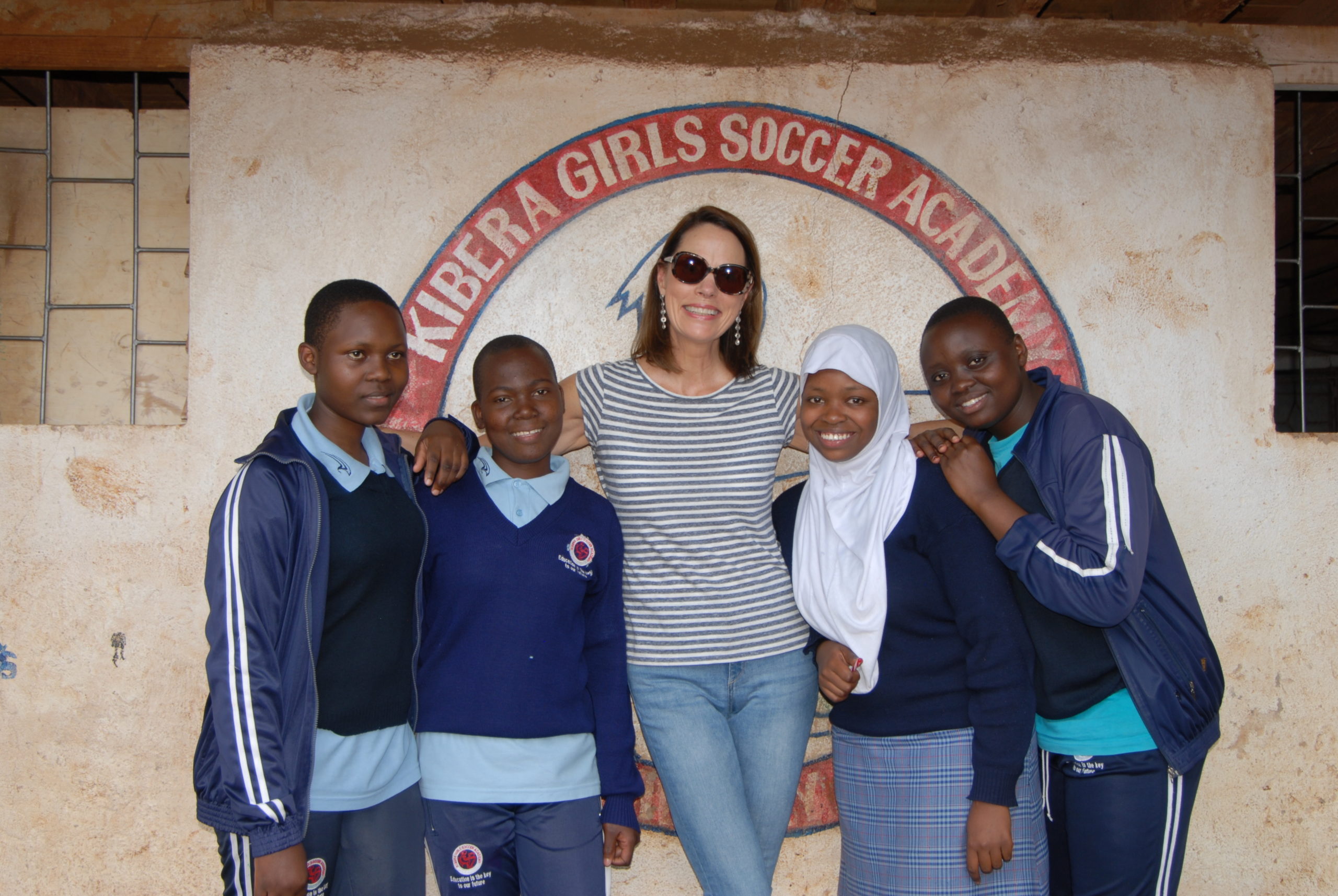 Global Give Back Circle founder Linda Latsko-Lockhart with girls at the Kibera Girls Soccer Academy in Nairobi, Kenya.