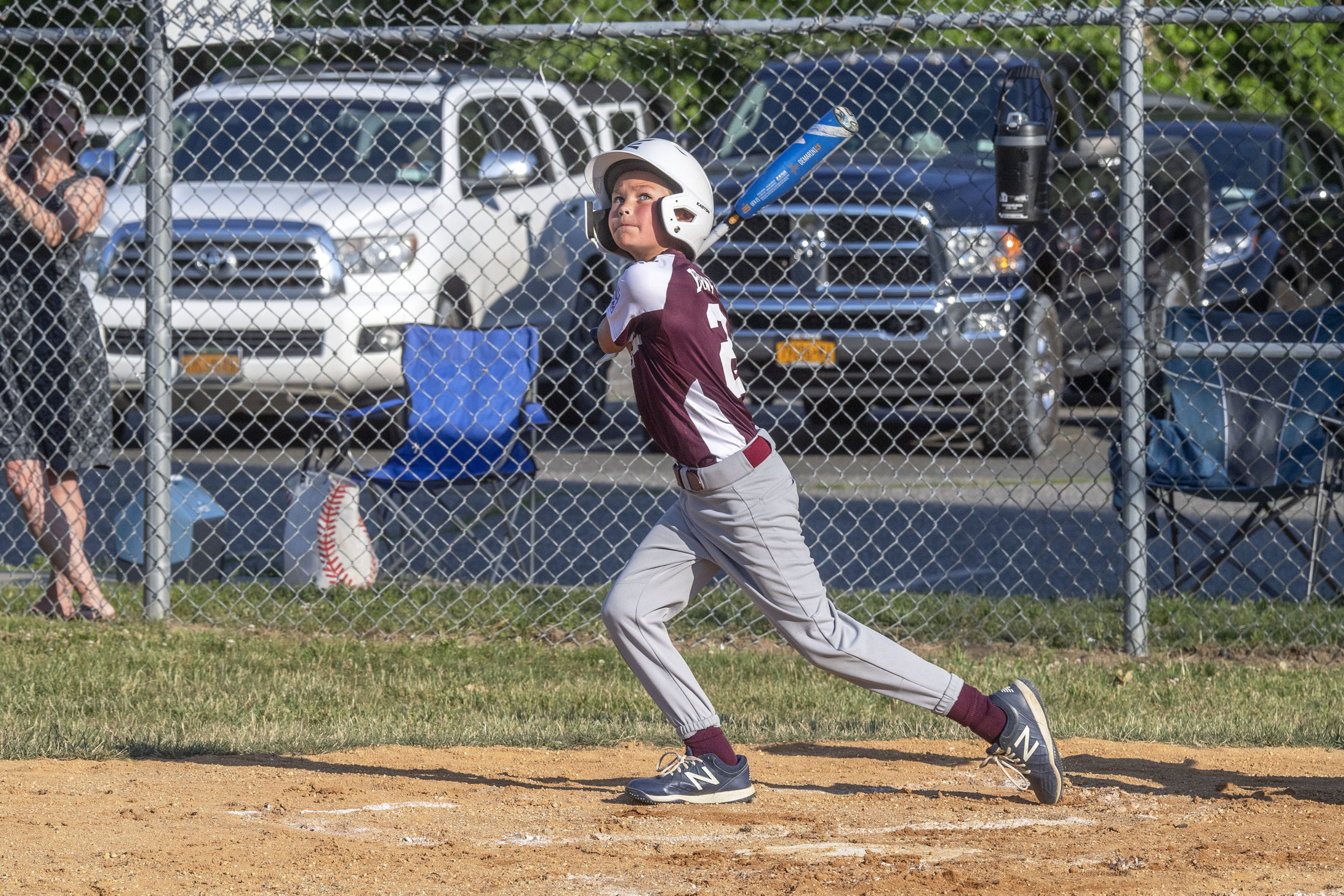 East Hampton's Parker Burns watches the ball after getting a hit.