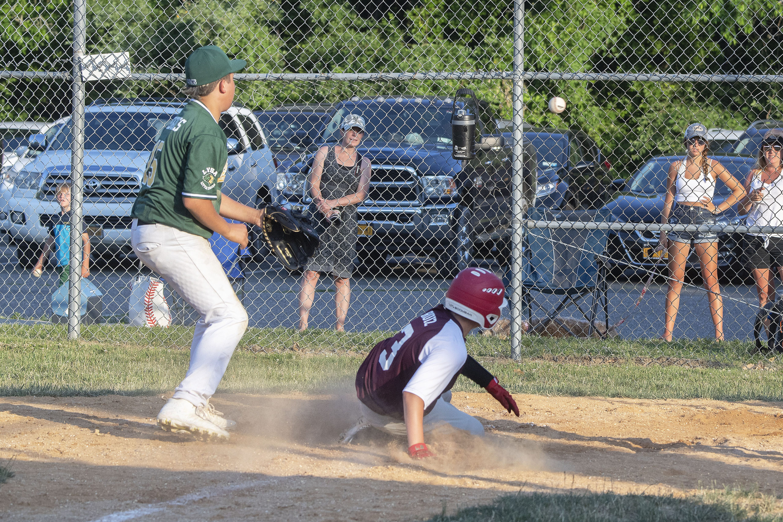 East Hampton's Dennis Ruiz scores on a wild pitch.