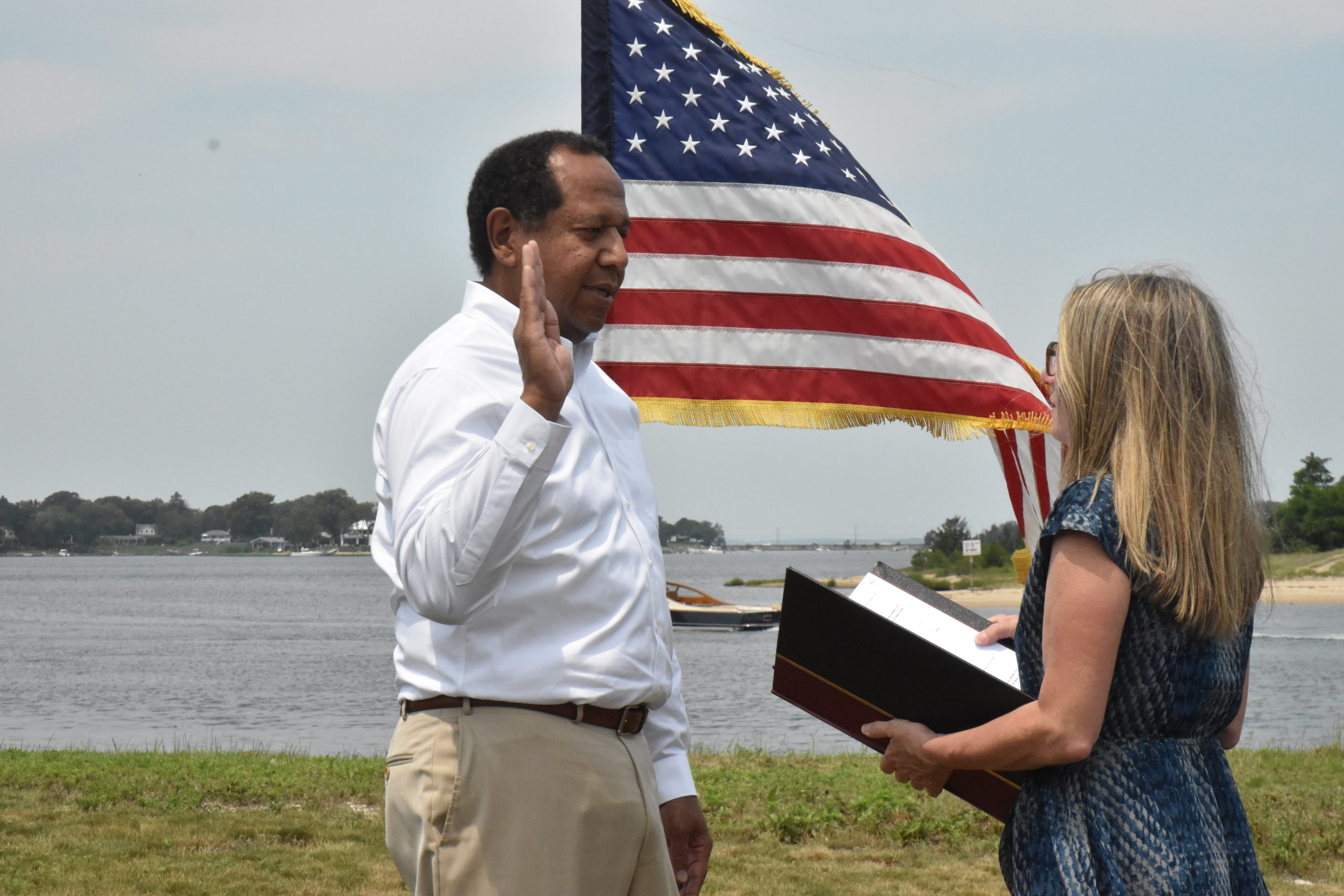 New Sag Harbor Village Trustee Ed Haye is sworn in by Village Clerk Beth Kamper.  STEPHEN J. KOTZ