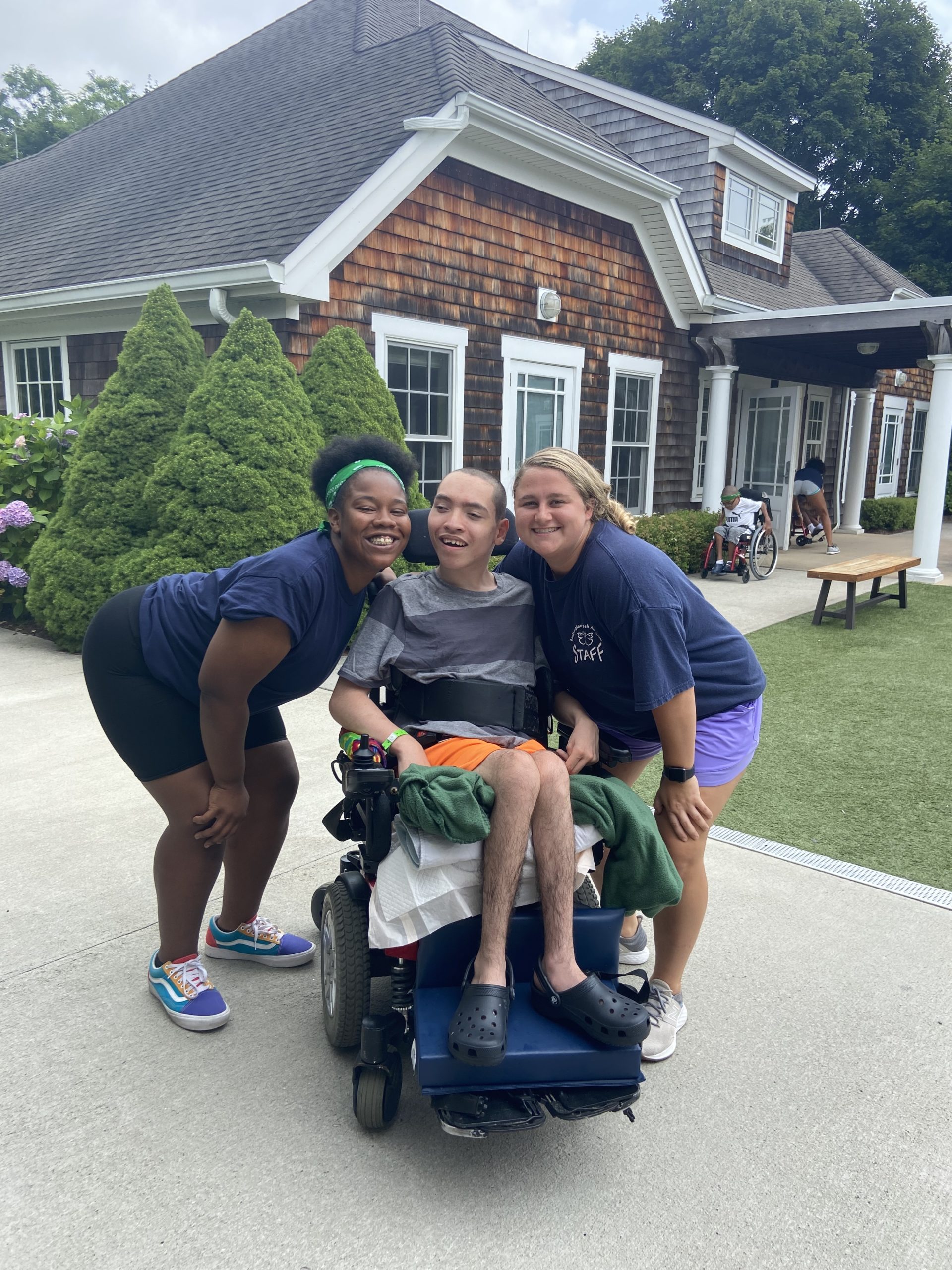 Camper Joshua with two of his counselors.