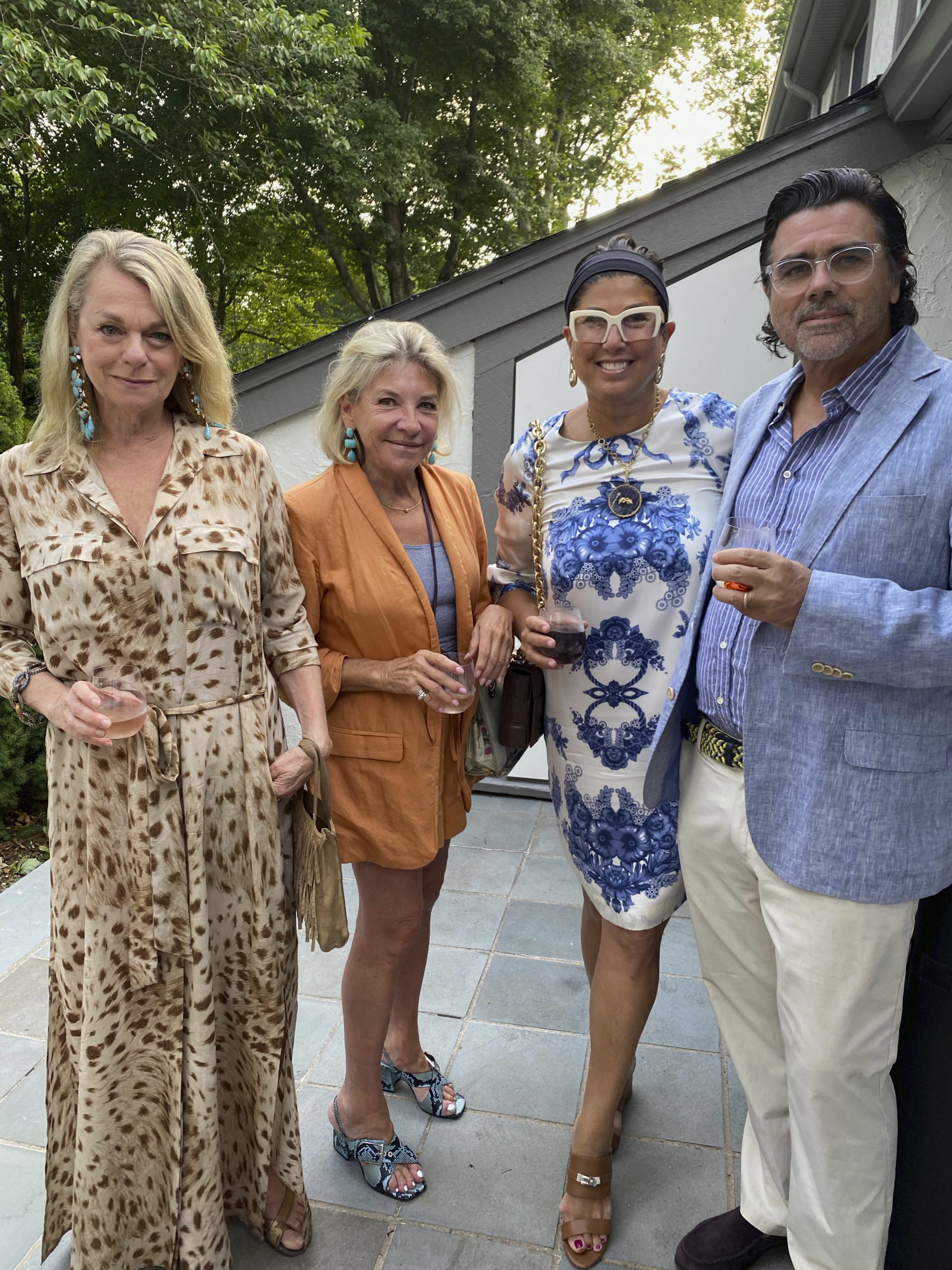 Debbie Bancroft, Monique Merrill, Cricket and Richard Burns at a cocktail party.  GREG DELIA