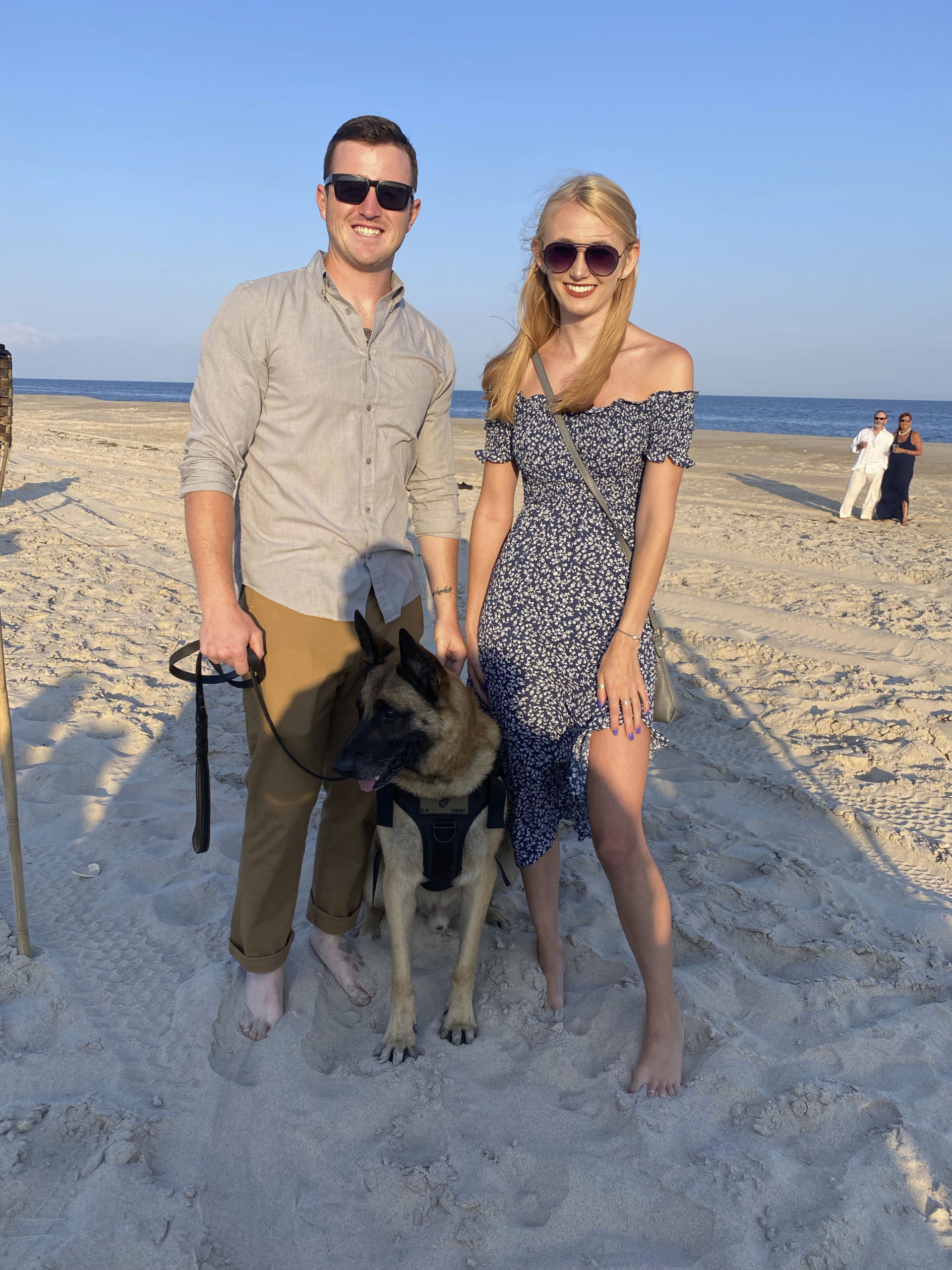 Retired Sargent Brendan Cabey with Ramos and Olivia Dolitka at Dogs on the Dunes.  GREG DELIA