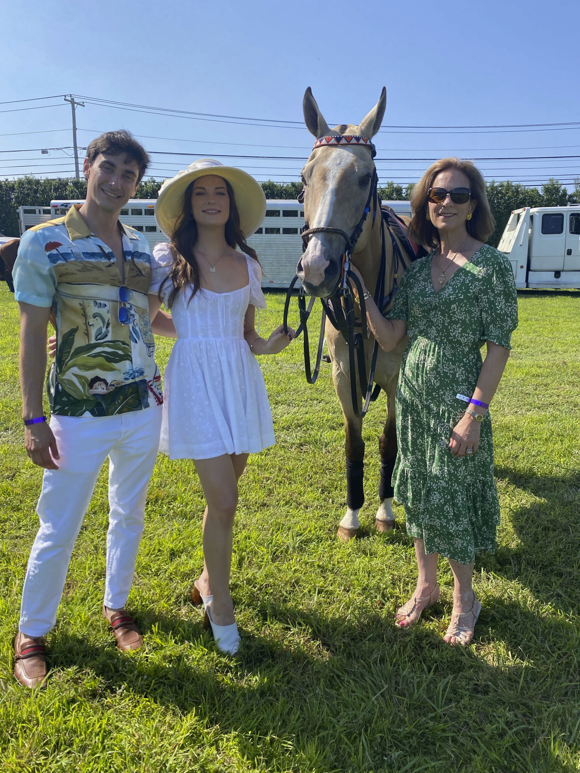 Bardley Fishel with Vivian and Paige Louthan with Caramello one of the polo ponies.   GREG DELIA