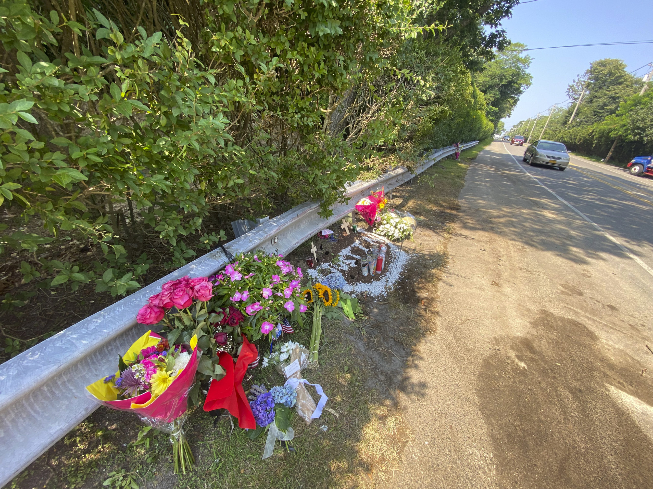 A makeshift memorial has been set up at the crash site on Montauk Highway in Quogue.  DANA SHAW