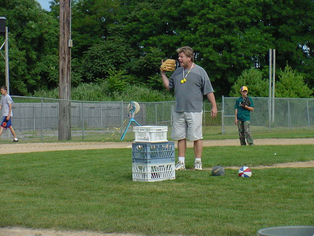 Rob Nelson tossing batting practice.