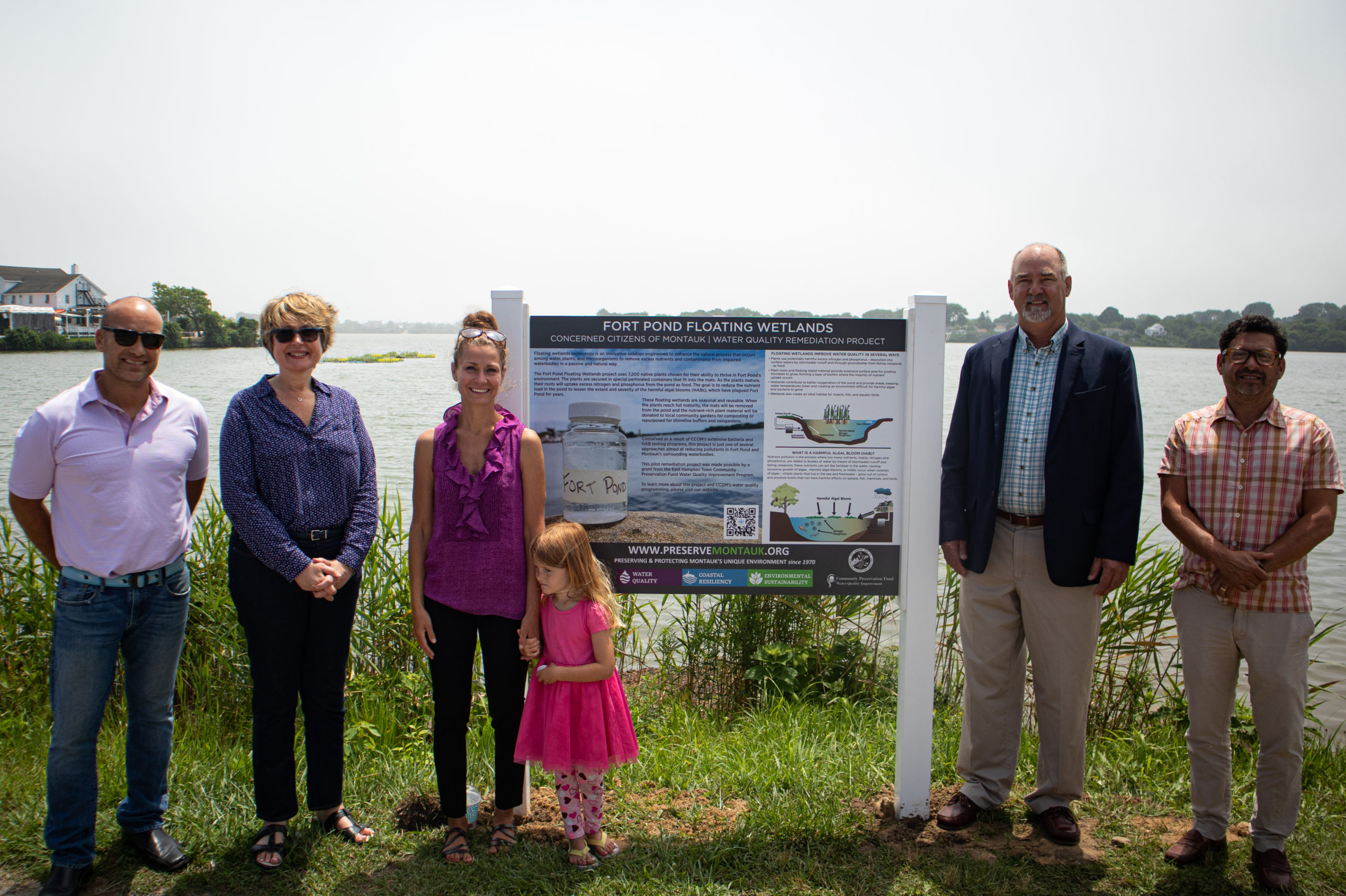 Board Member David Lys, Deputy Supervisor Kathee Burke-Gonzalez, CCOM President Laura Tooman (and her daughter), Supervisor Peter Van Scoyoc and CCOM Chairman David Freudenthal at an unveiling of new educational wetlands signs at Fort Pond earlier this month.