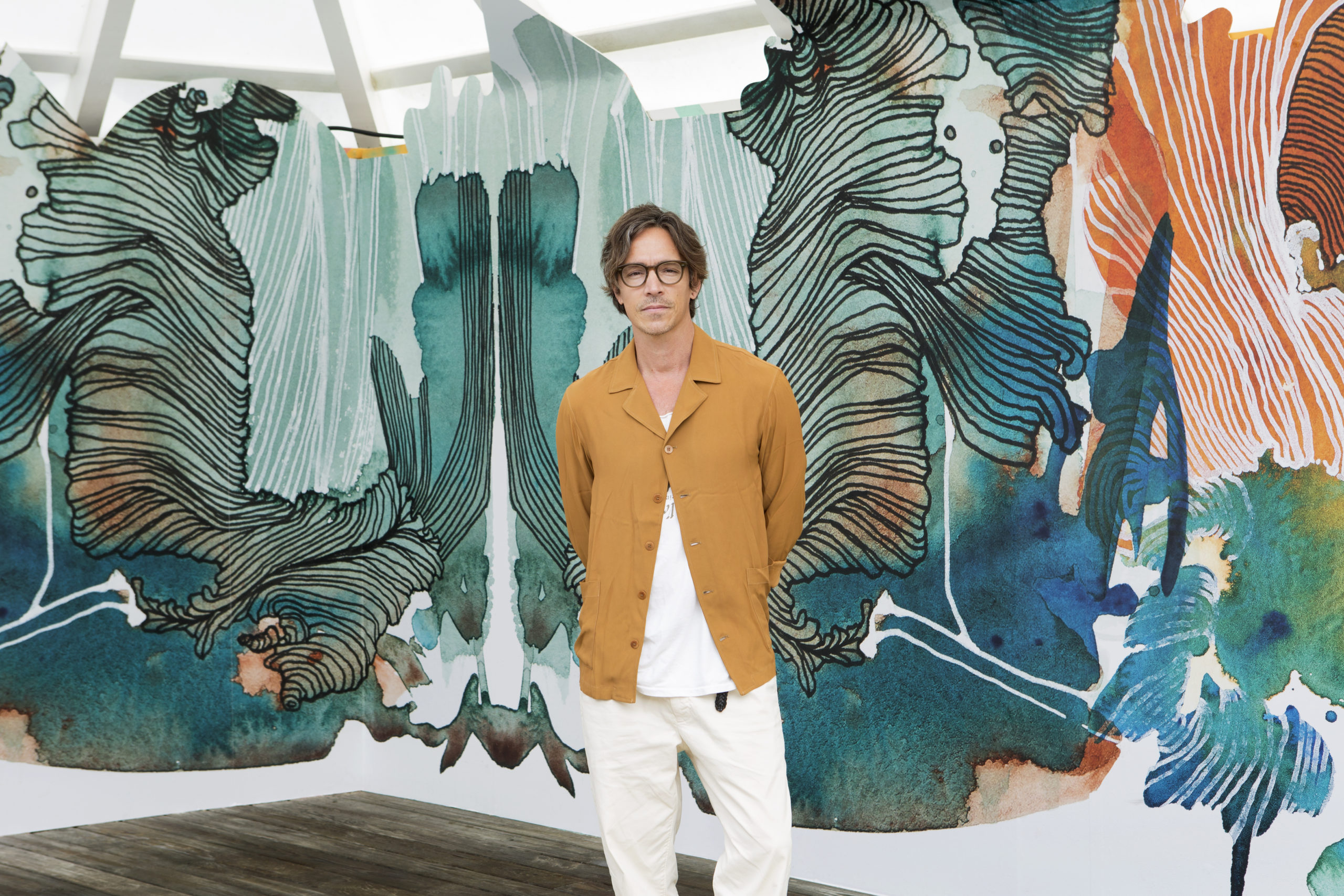Brandon Boyd with his mural at Surf Lodge.