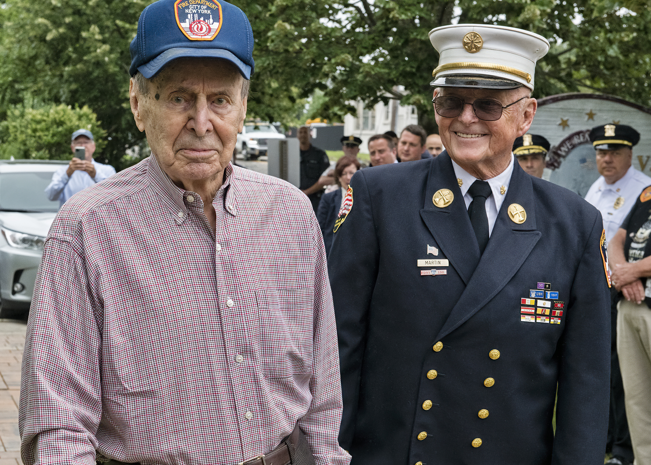 : VFW  Post 5350 in Westhampton Beach hosted a New York Fire Department ceremony honoring 99-year-old World War II veteran Chester Moscicki, of Center Moriches, on July 13. Mr. Moscicki, shown left arriving at the ceremony with retired NYFD Chief Thomas Martin, served as a tail gunner on a B-26, flying more than 35 missions over Japan. He was credited with shooting down a Japanese Zero and survived a crash landing on the island of Tinian. After the war he joined the NYFD where he served for more than 30 years, retiring with the rank of captain.