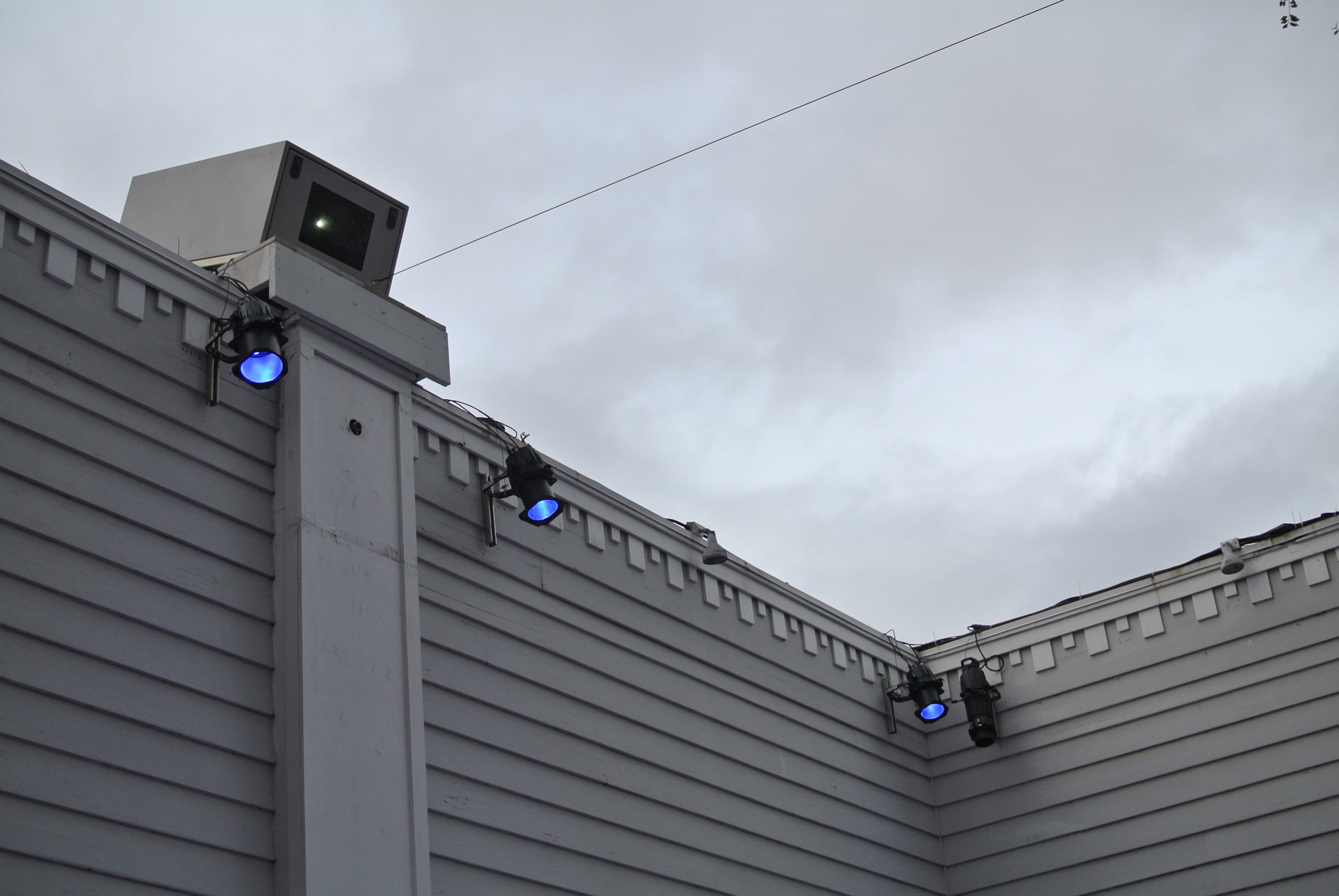 Projectors placed around the courtyard.