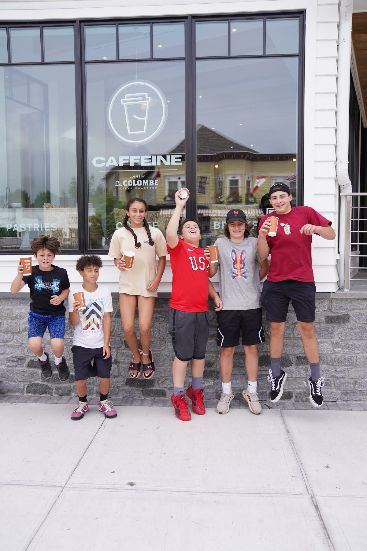 Young coffee and smoothie lovers outside the new shop in Westhampton.