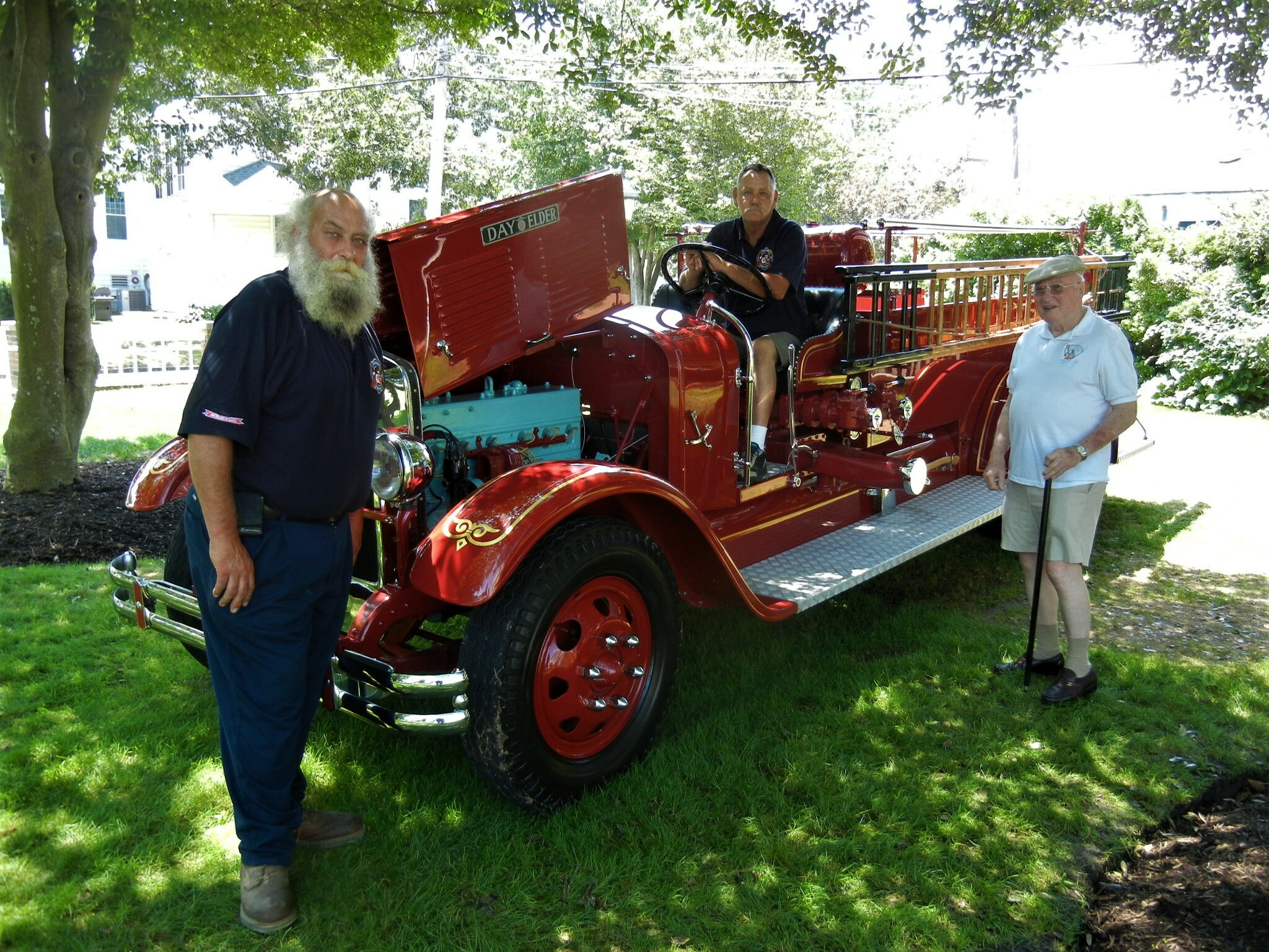 Volunteers with one of the antique fire trucks on display in 2018.