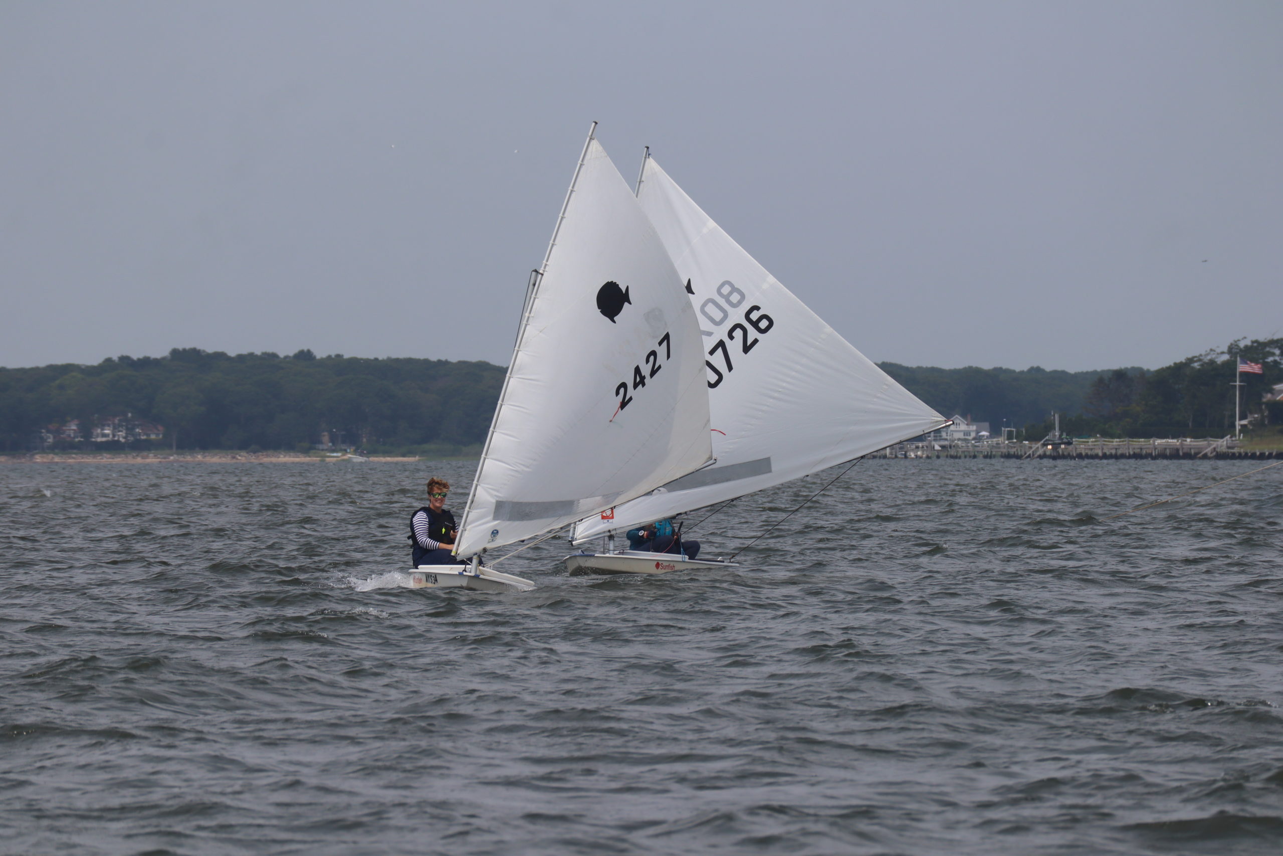 Vanessa Winters (2427) and Suzanne Hulme in the sunfish races.