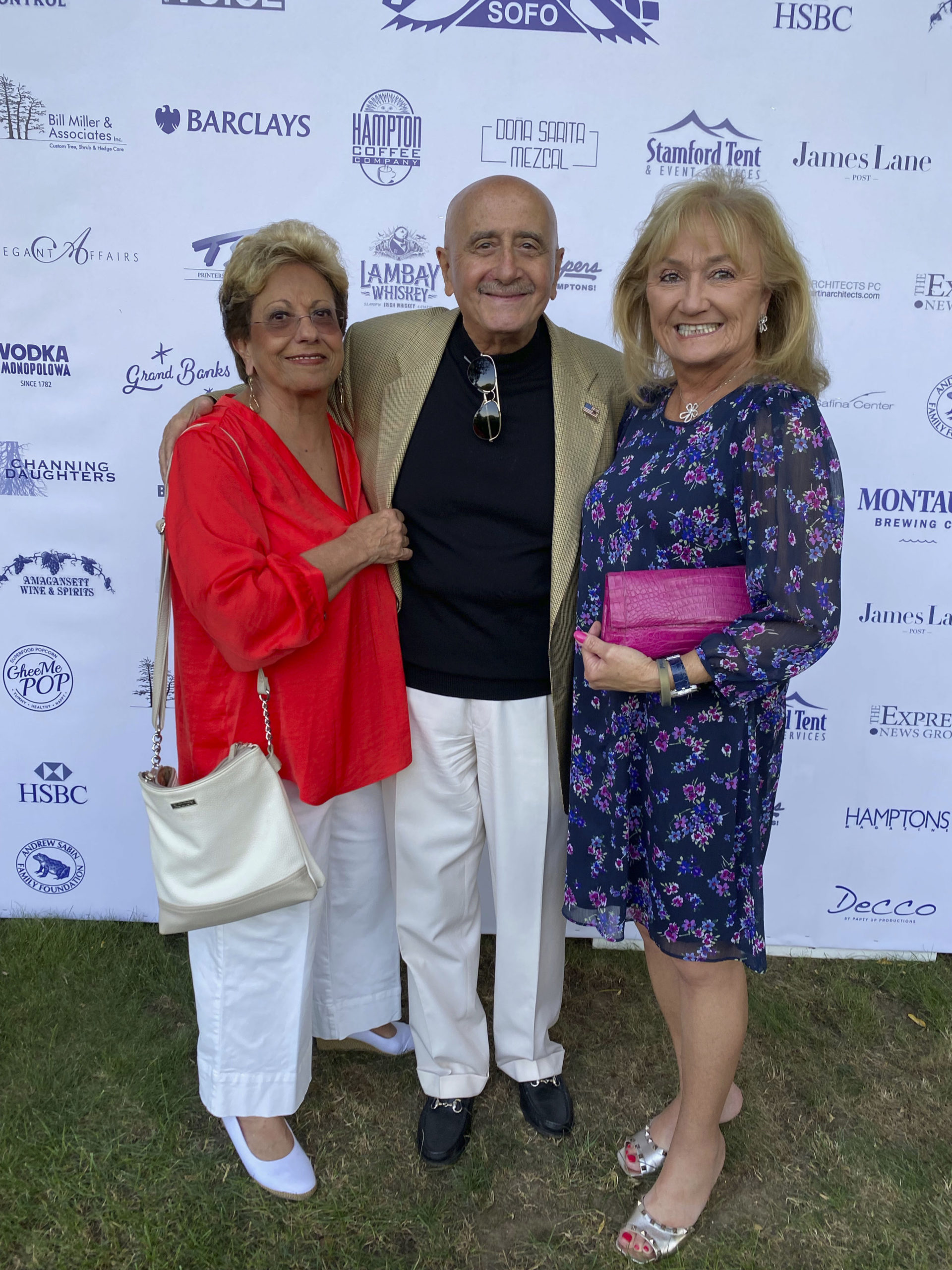 Carol Burke with Dick and Lori Grasso at the South Fork Natural History Museum summer Gala.   GREG DELIA
