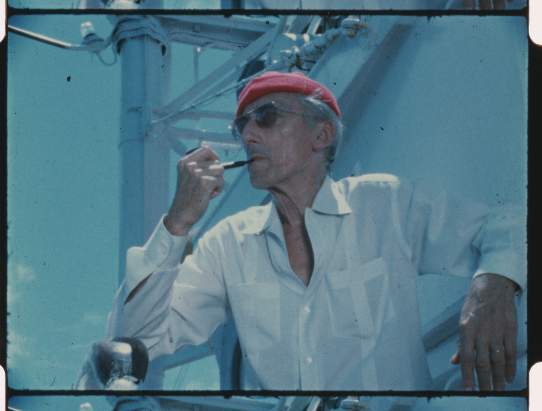 Jacques Cousteau wears his iconic red diving cap aboard his ship Calypso, circa 1970s.