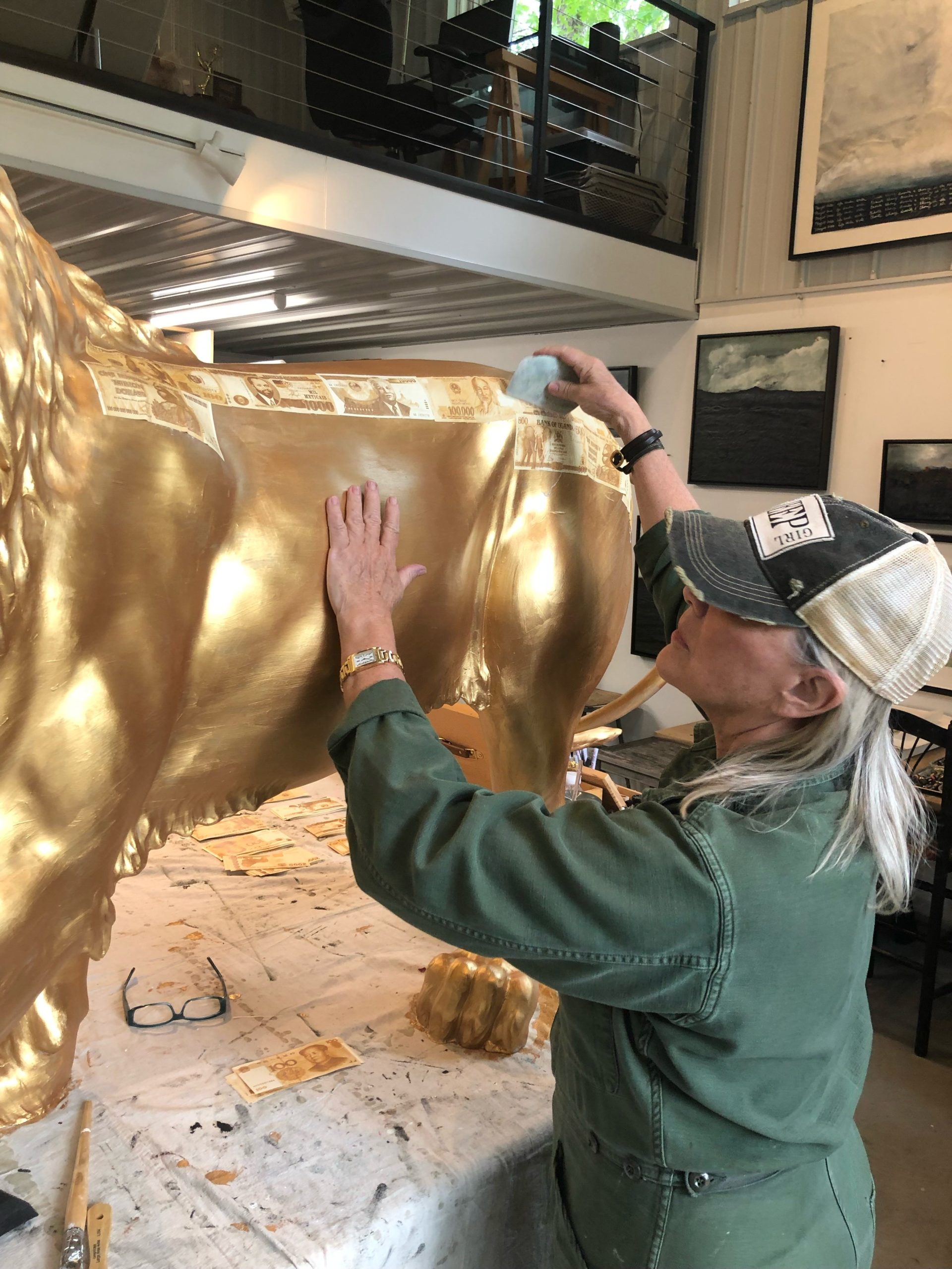 Beth O’Donnell works on her lion sculpture, 