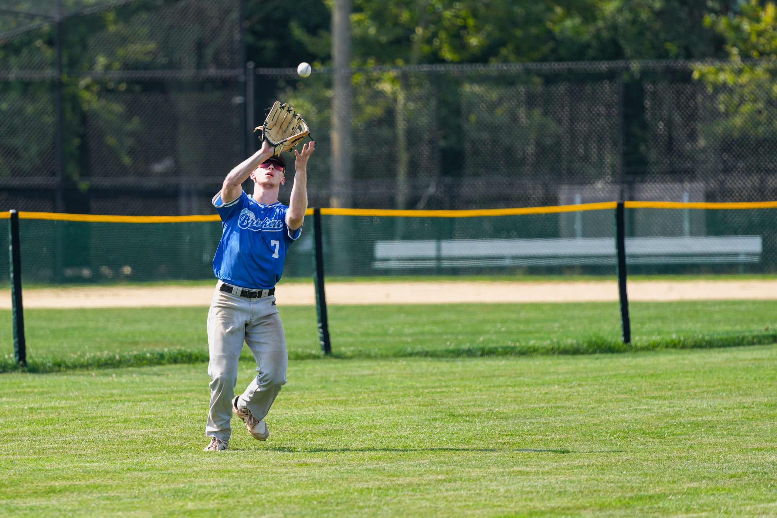 Breaker Tyler Robinson (Dartmouth) settles underneath and catches a fly ball for an out.