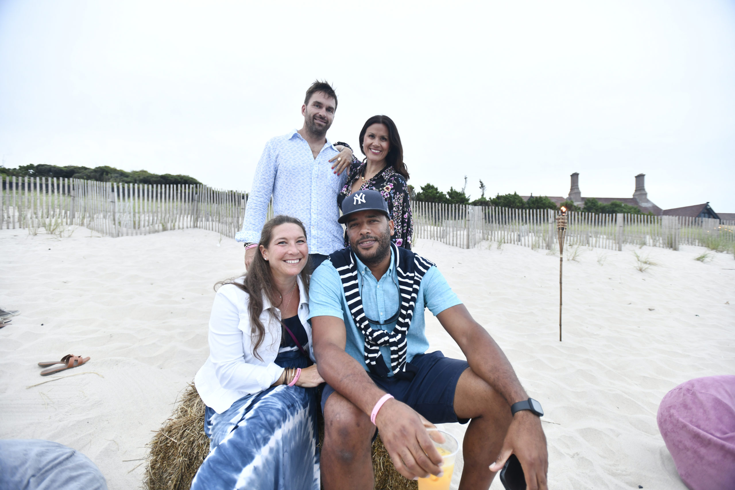 Chris Miller and Sandra Liveric with Elizabeth Phenis and Marc Anthony at the Southampton Animal Shelter Foundation's beach party fundraiser, 